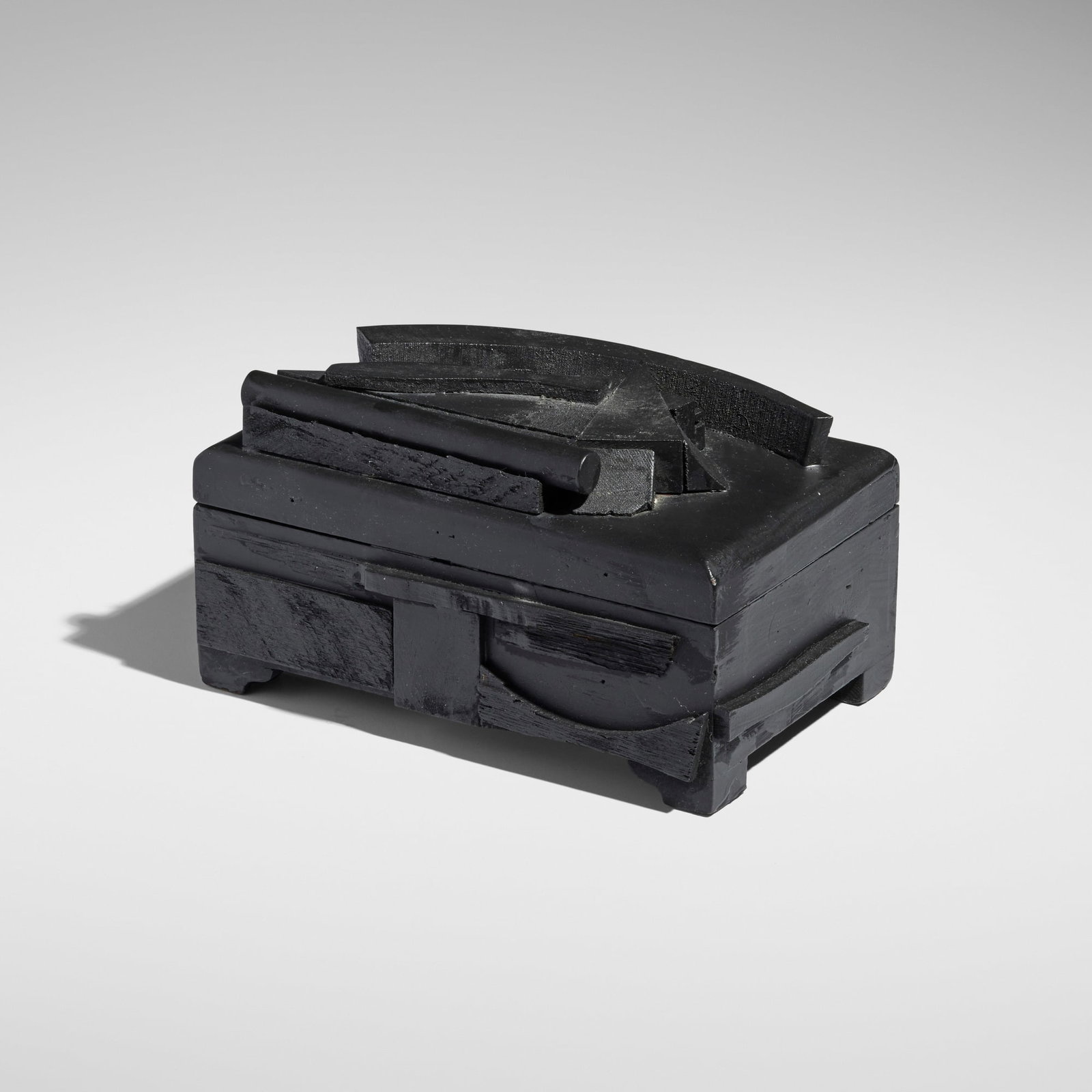 Louise Nevelson, Black Cryptic LXVII: Louise Nevelson Black Cryptic LXVII 1979wood painted construction 5.125 h x 9.375 w x 6.75 d in (13 x 24 x 17 cm) Sold with a copy of Nevelson's World by Jean Lipman. Pro
