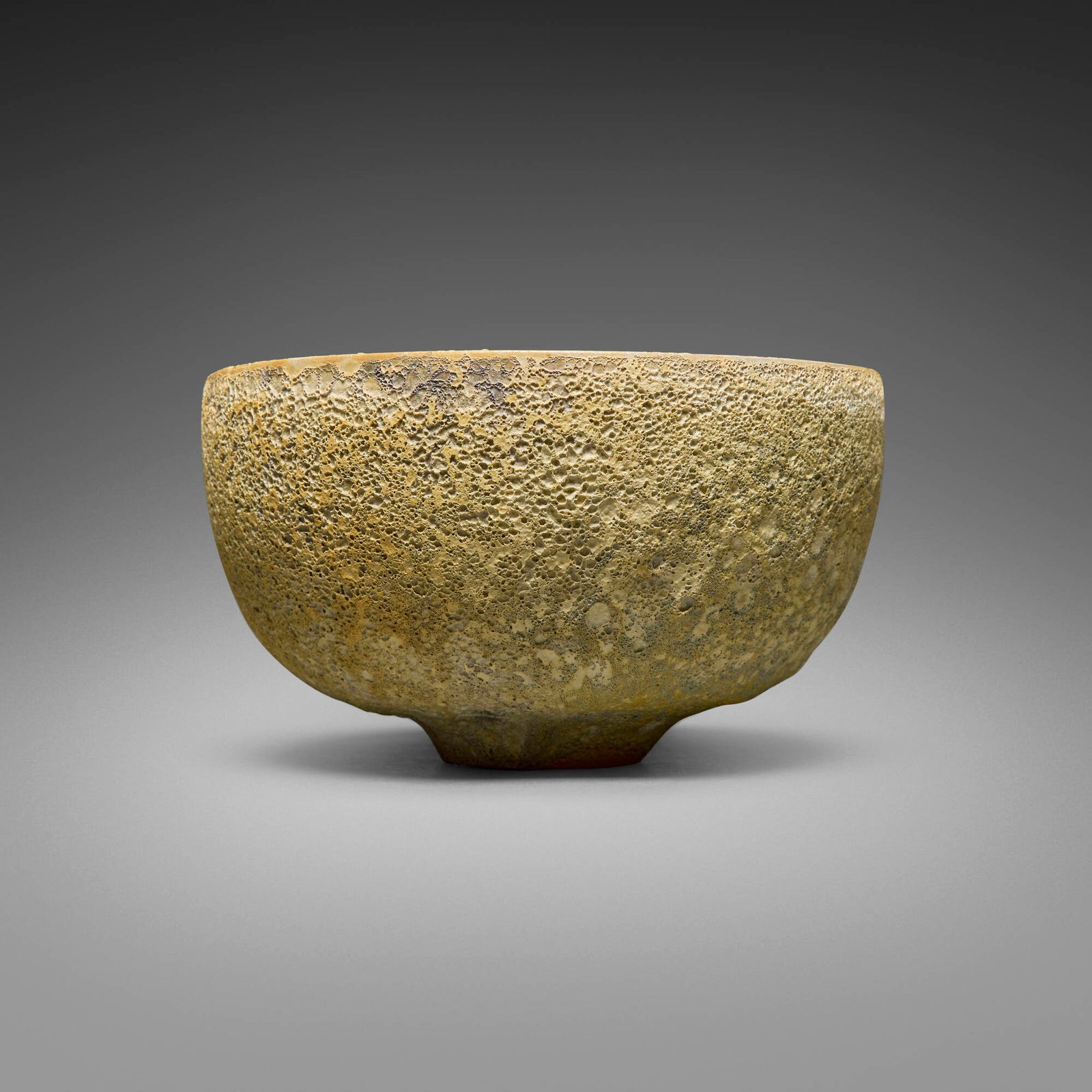 Gertrud and Otto Natzler, Rounded bowl: Gertrud and Otto Natzler Rounded bowl 1963earthenware with Ivory Sulphur Crater glaze 4.5 h x 8 dia in (11 x 20 cm) Signed to underside 'Natzler' with archive number 'M900' and red tape notati