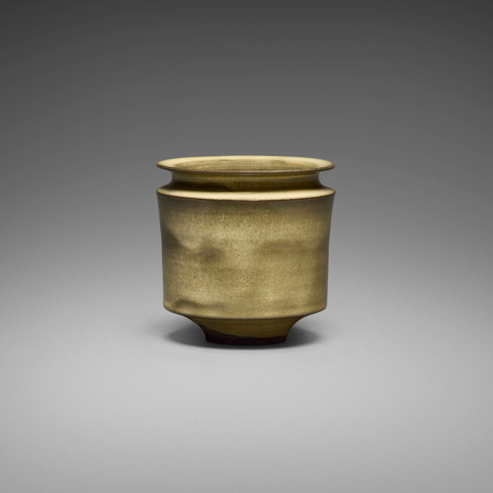 Gertrud and Otto Natzler, Vase with indented top and flange: Gertrud and Otto Natzler Vase with indented top and flange 1962earthenware with Ivory Celadon Reduction Fired glaze 4 h x 4 dia in (10 x 10 cm) Signed to underside 'Natzler' with archive numbe