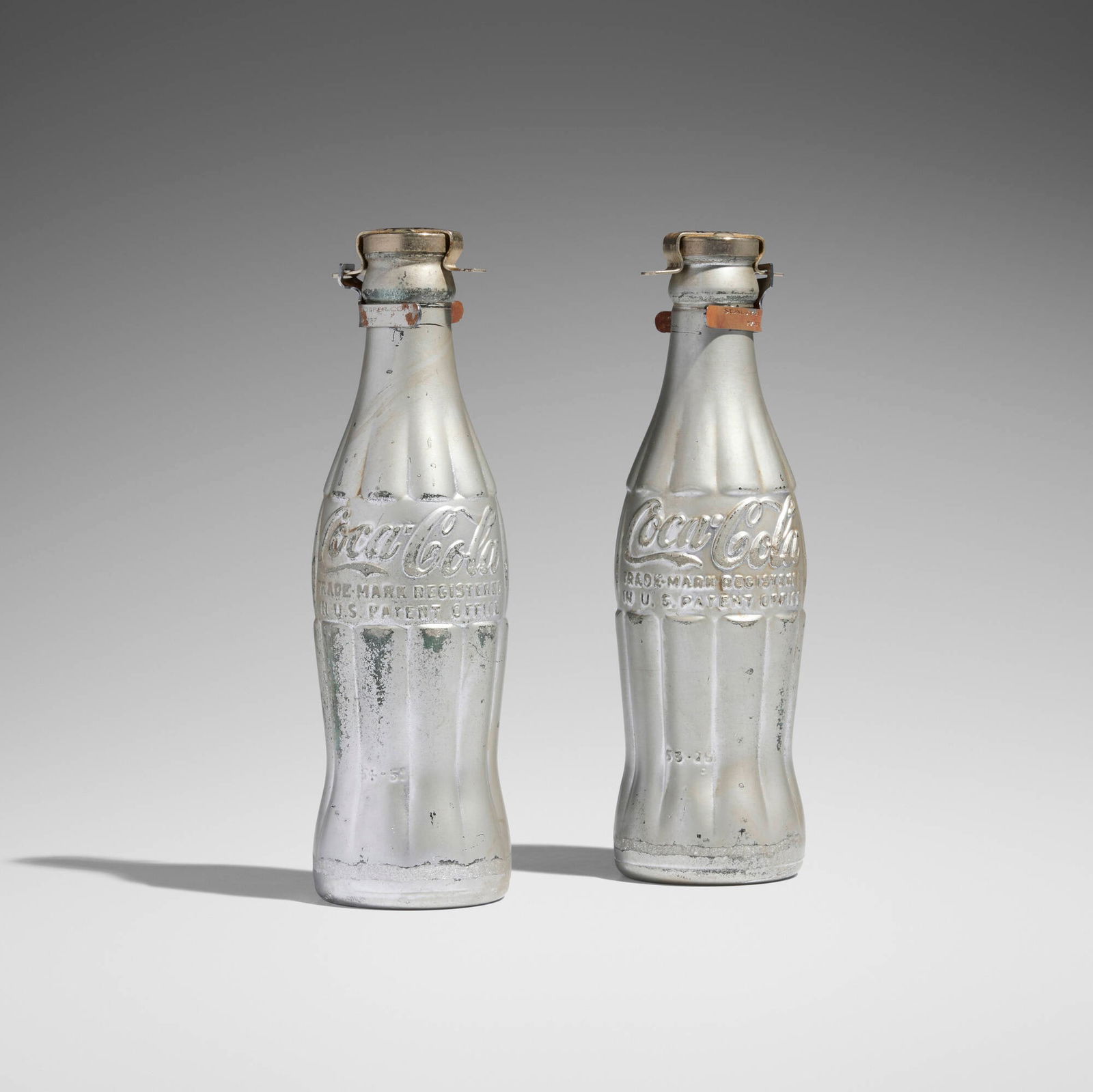 Andy Warhol, You're In (two works): Andy Warhol You're In (two works) 1967 spray paint on Coca-Cola bottle each: 8 h x 2.375 w x 2.375 d in (20 x 6 x 6 cm) In 1967, the Arts Council of the Philadelphia Y.M.H.A. presented Museum of