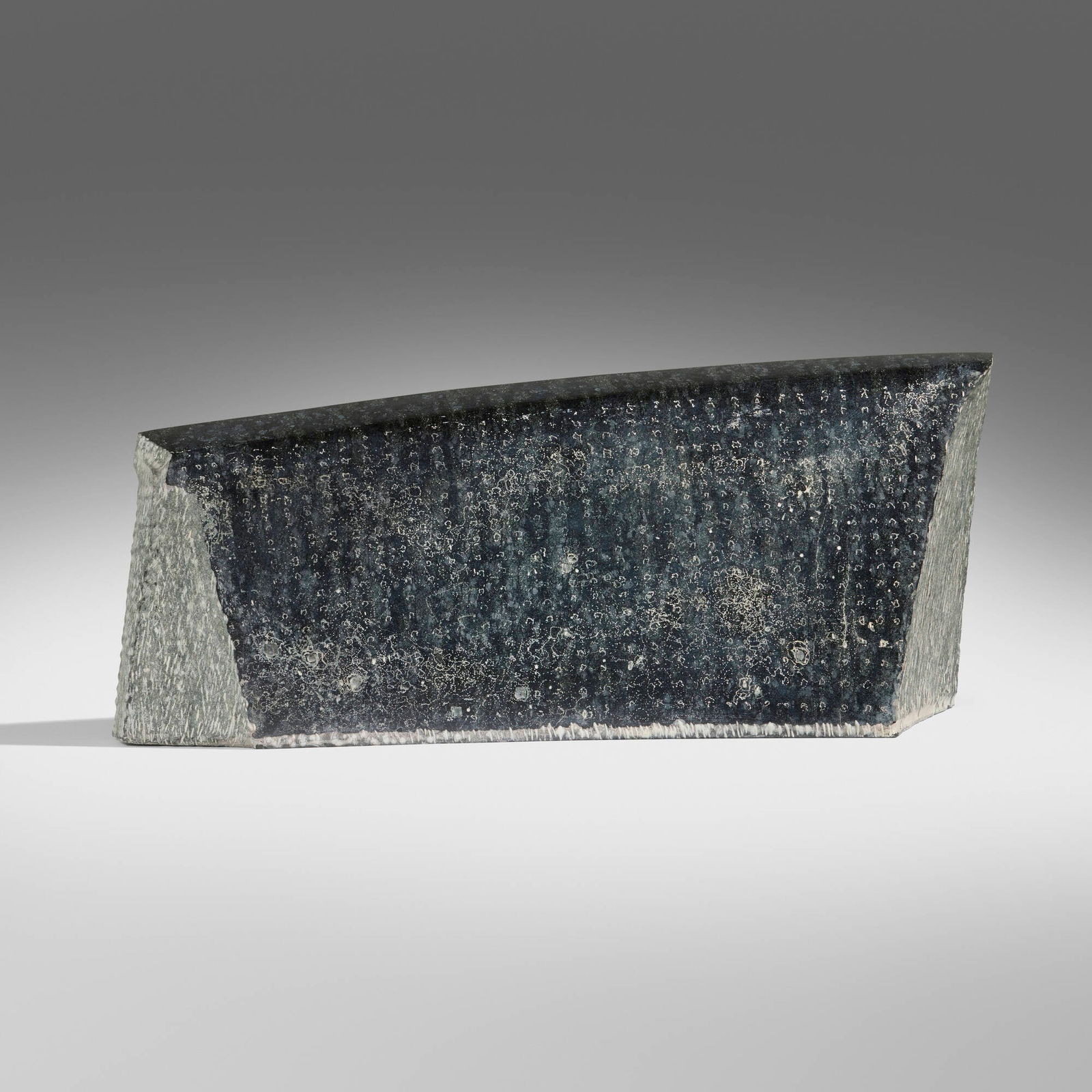 Yves Dana, Pierre de memoires: Yves Dana Pierre de memoires 2014 polychrome diabase 9.25 h x 24.25 w x 6.75 d in (23 x 62 x 17 cm) Signed to reverse 'Dana'. Provenance: Acquired directly from the artist in 2021 by the present