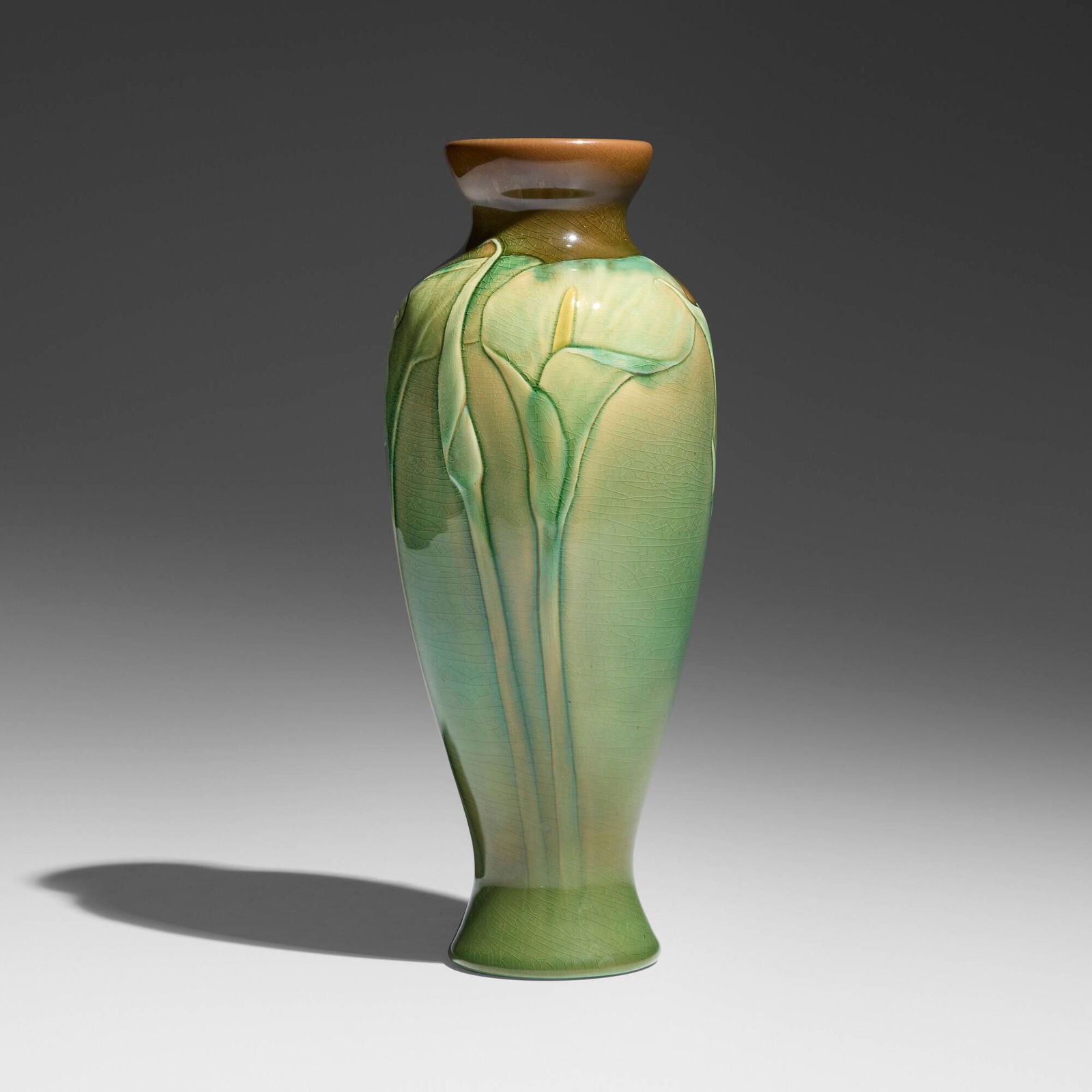 Matthew Daly for Rookwood Pottery, Sea Green vase with calla lilies: Matthew Daly for Rookwood Pottery Sea Green vase with calla lilies USA, 1899glazed earthenware 11.25 h x 4.25 dia in (29 x 11 cm) Impressed manufacturer's mark to underside 'Flame mark 792C' w