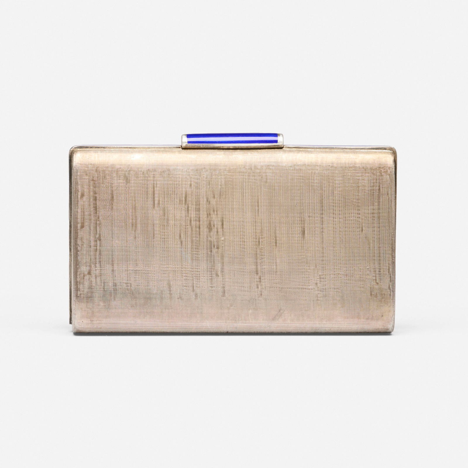 Cartier, Enamel and sterling silver minaudiere: Cartier Enamel and sterling silver minaudiere Of Florentine finish, edged in blue enamel Sterling silver Signed Cartier 5.50 x 3.50 x 1.25 in; Gross weight 204.6 dwts This wo