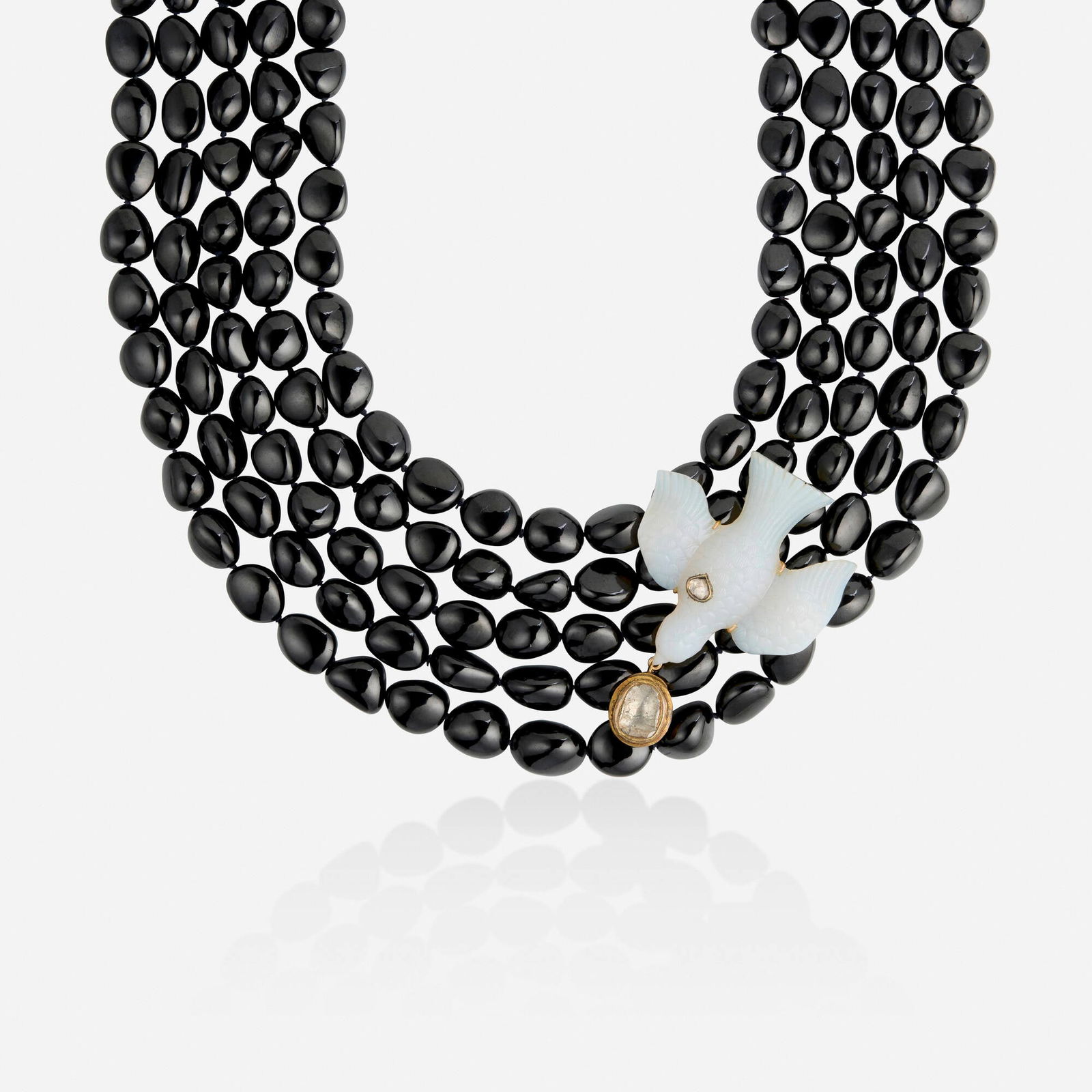 Oscar de la Renta, Multi-gem, diamond, and gold necklace: Oscar de la Renta Multi-gem, diamond, and gold necklace Strung with five strands of black garnets beads, centered on a carved chalcedony bird with two polki-cut diamonds Yellow gold Approx. 18.50 in;