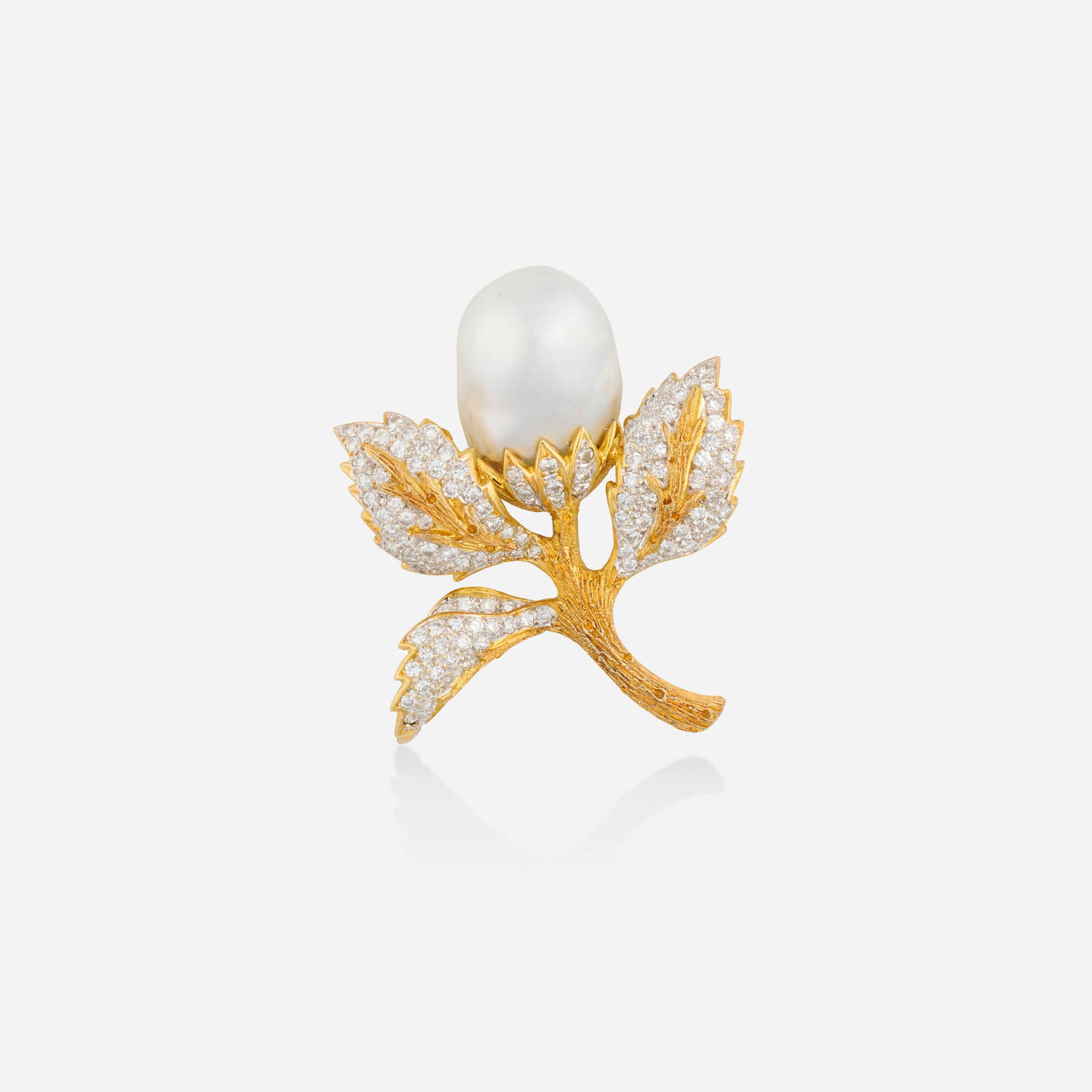 Baroque cultured pearl, diamond, and bicolor gold brooch: Baroque cultured pearl, diamond, and bicolor gold brooch Of foliate design, set with a baroque cultured pearl and round brilliant-cut diamonds 18k yellow and white gold 1.75 x 1.50 in; Gross weight 12