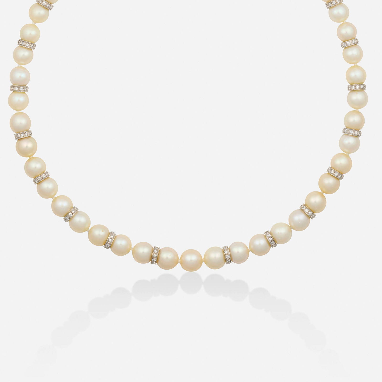 Cultured pearl, diamond, and white gold necklace: Cultured pearl, diamond, and white gold necklace Strung with cultured pearls and round brilliant-cut diamond rondelles, the clasp set with a cultured pearl and single-cut diamonds 14k white gold 18.50