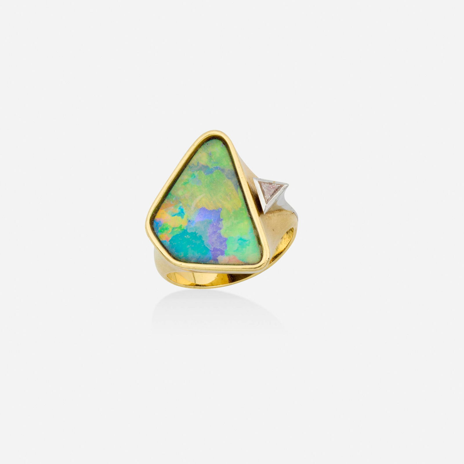 Atelier Munsteiner, Opal, diamond, and gold ring: Atelier Munsteiner Opal, diamond, and gold ring Set with a polished boulder opal and a triangular-cut diamond 18k yellow and white gold Signed with maker's mark for Atelier Munsteiner Ring size 7.50
