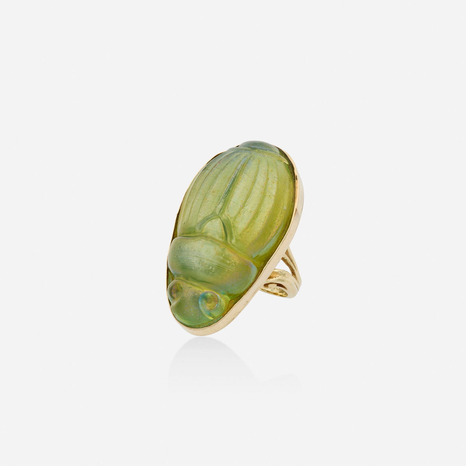 Glass and gold ring: Glass and gold ring Set with an iridescent glass carved scarab 14k yellow gold Ring size 6.25; Gross weight 13.1 dwts This work will ship from Lambertville, New Jersey.