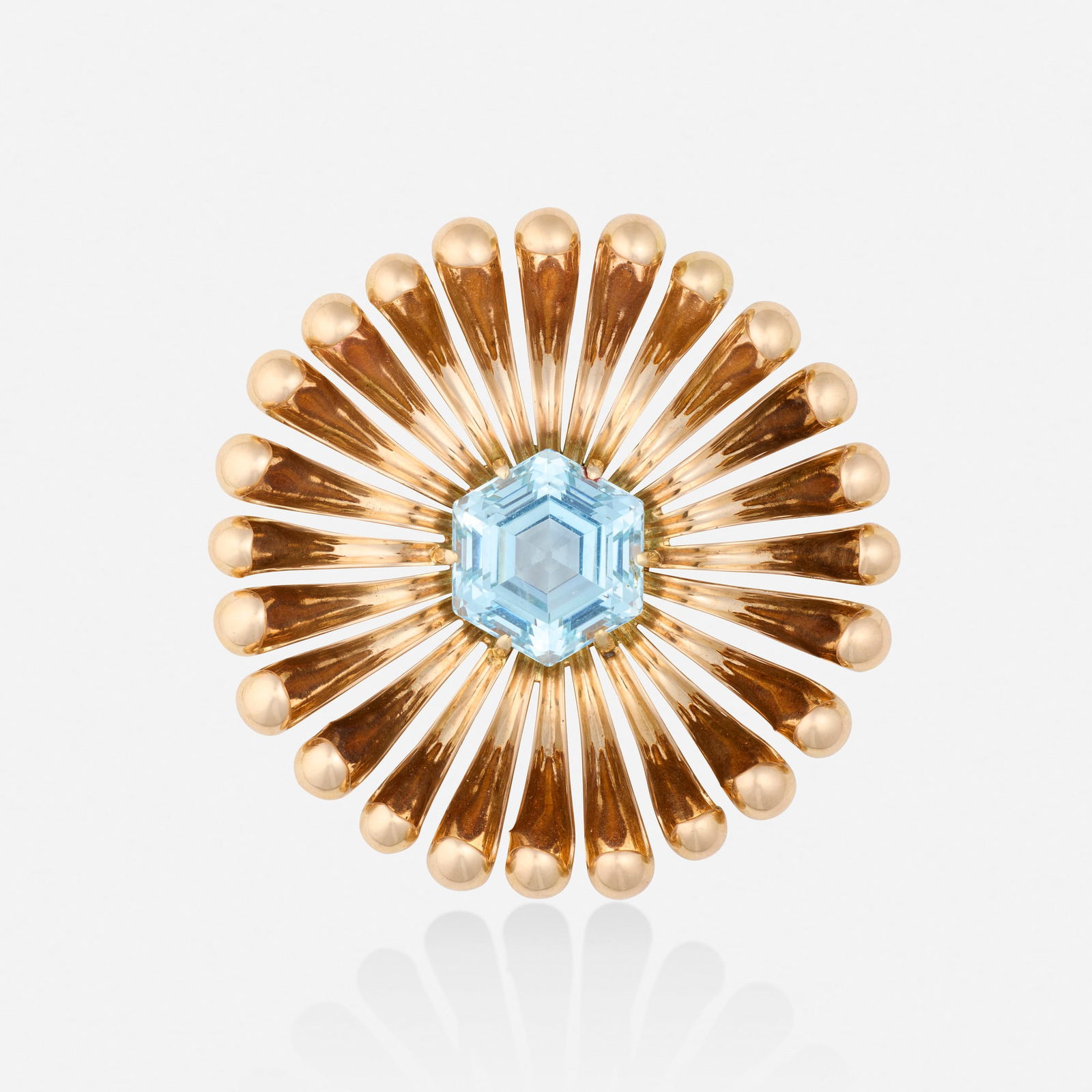 Retro, Aquamarine and pink gold brooch: Retro Aquamarine and pink gold brooch Of starburst design, set with a hexagonal-cut aquamarine 14k pink gold 2.50 in; Gross weight 32.4 dwts This work will ship from Lambertville, New
