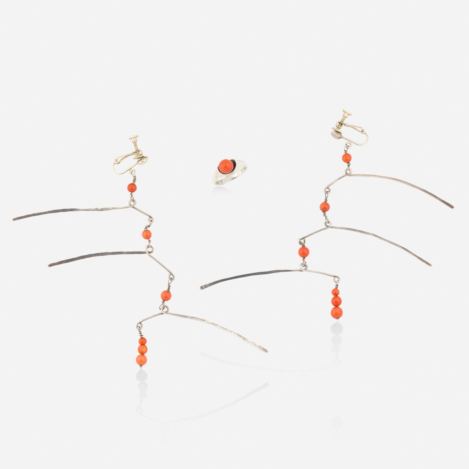 Ed Wiener, Silver and coral earrings and ring: Ed Wiener Silver and coral earrings and ring Each set with coral beads Silver Earrings approx. 4.375 x 2.625 in, ring size 5.25; Gross weight 8.5 dwts Provenance: Collection of Wil