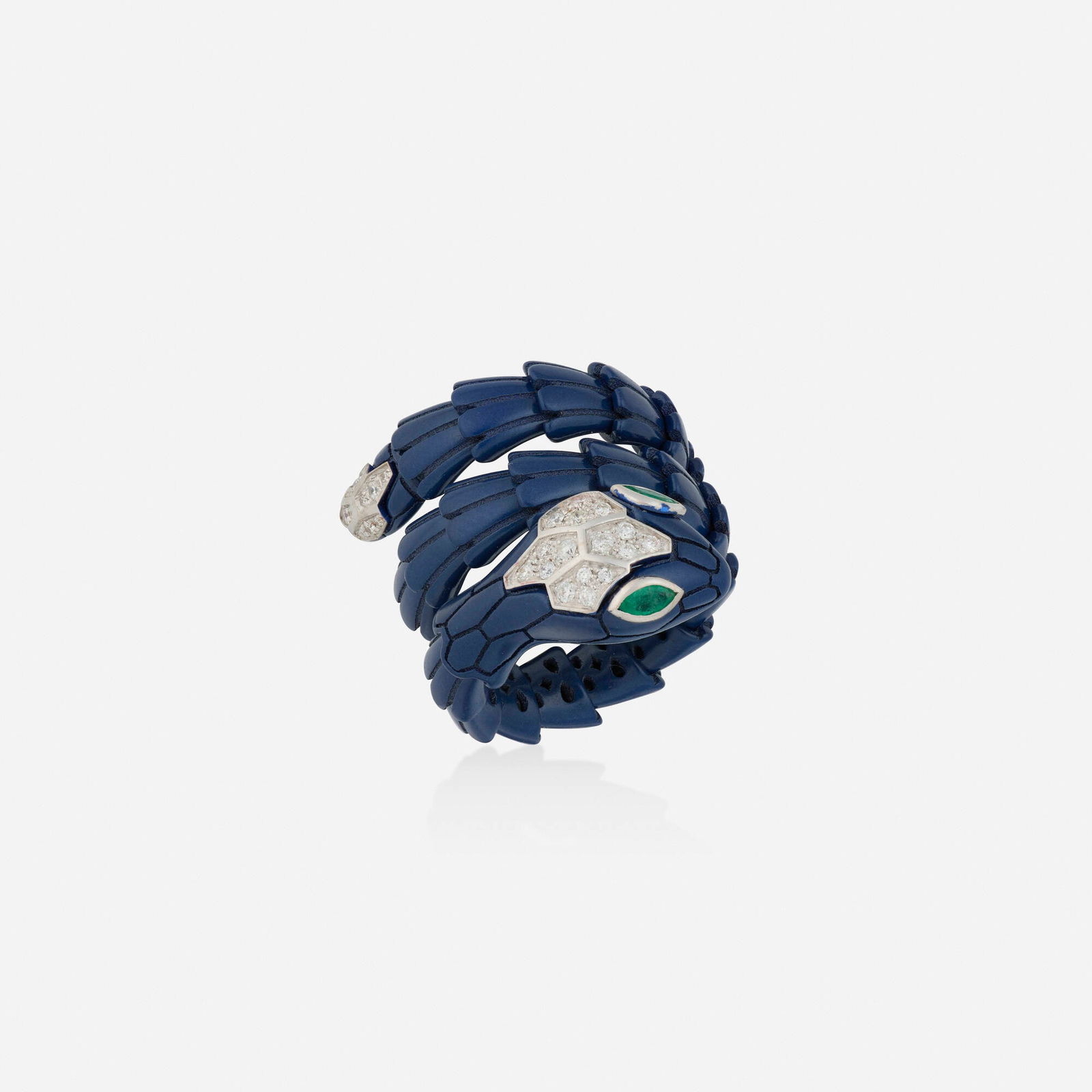 Alexis NY, Diamond, emerald, and enamel ring: Alexis NY Diamond, emerald, and enamel ring Designed as a coiled snake with blue enamel scales, round brilliant-cut diamond head and marquise-cut emerald eyes Titanium and 18k white gold Signed