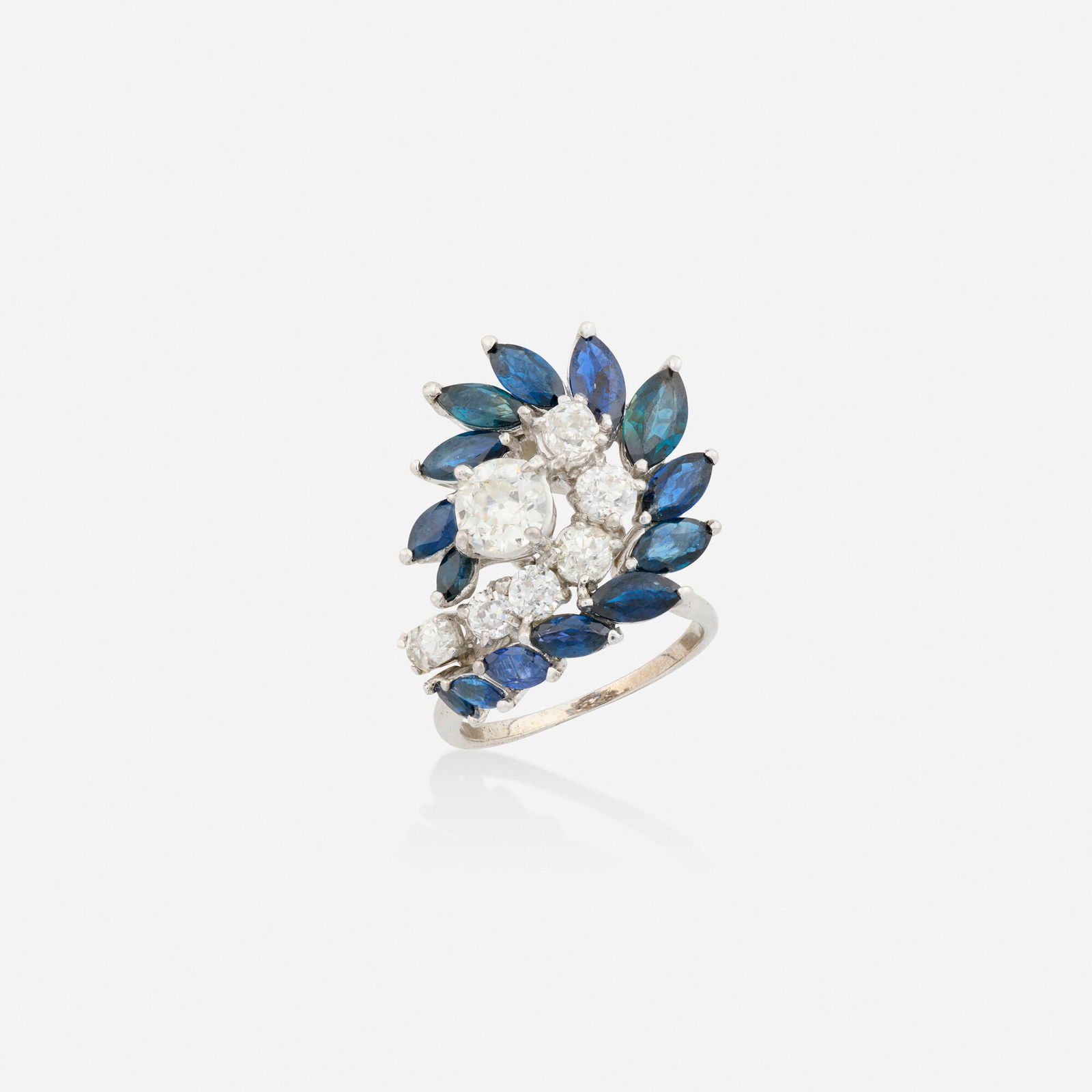 Diamond and sapphire ring: Diamond and sapphire ring Set with marquise-cut sapphires and old European-cut diamonds Platinum and white gold Ring size 6; Gross weight 6.4 dwts This work will ship from Lambertville, New Jersey.