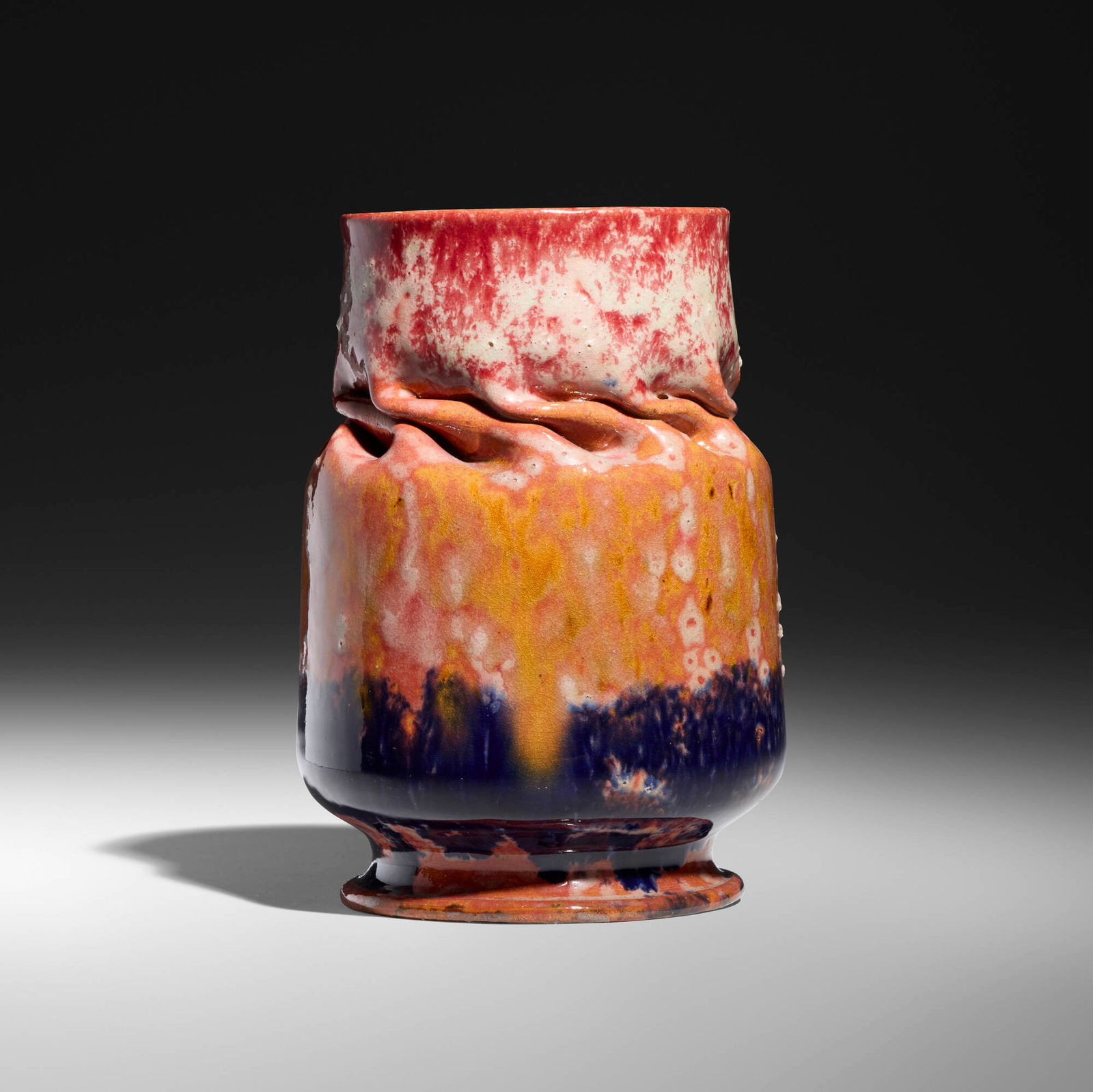 George E. Ohr, Vase: George E. Ohr Vase USA, 1897-1900glazed earthenware 5.5 h x 4 dia in (14 x 10 cm) Vase features a deep in-body twist and a sponged-on raspberry, indigo and white "blister" glaze with an orange