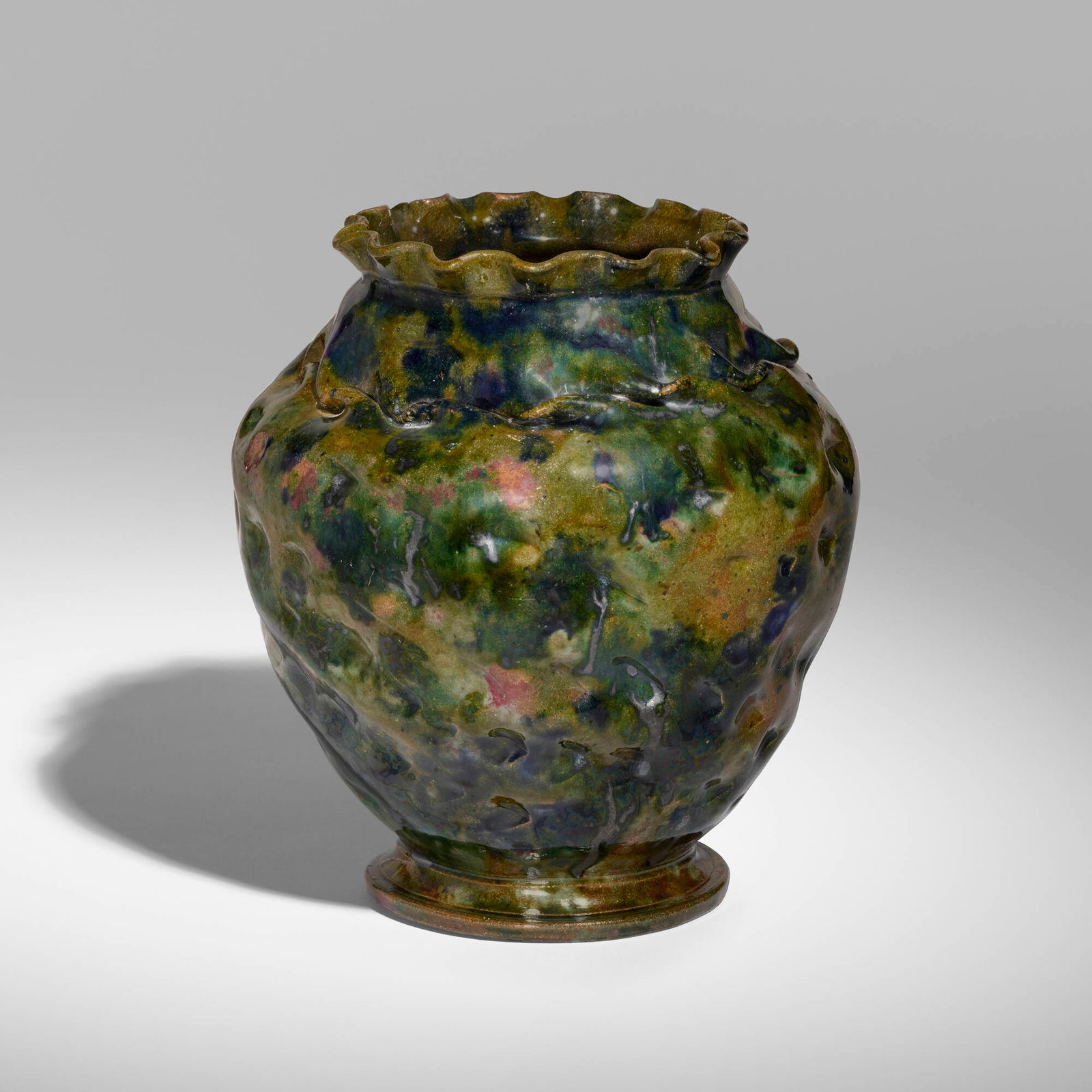 George E. Ohr, Large vase: George E. Ohr Large vase USA, 1897-1900glazed earthenware 7.25 h x 6.75 dia in (18 x 17 cm) Vase features a ruffled rim, dimples and an in-body twist with a mottled brown, emerald, indigo, ras