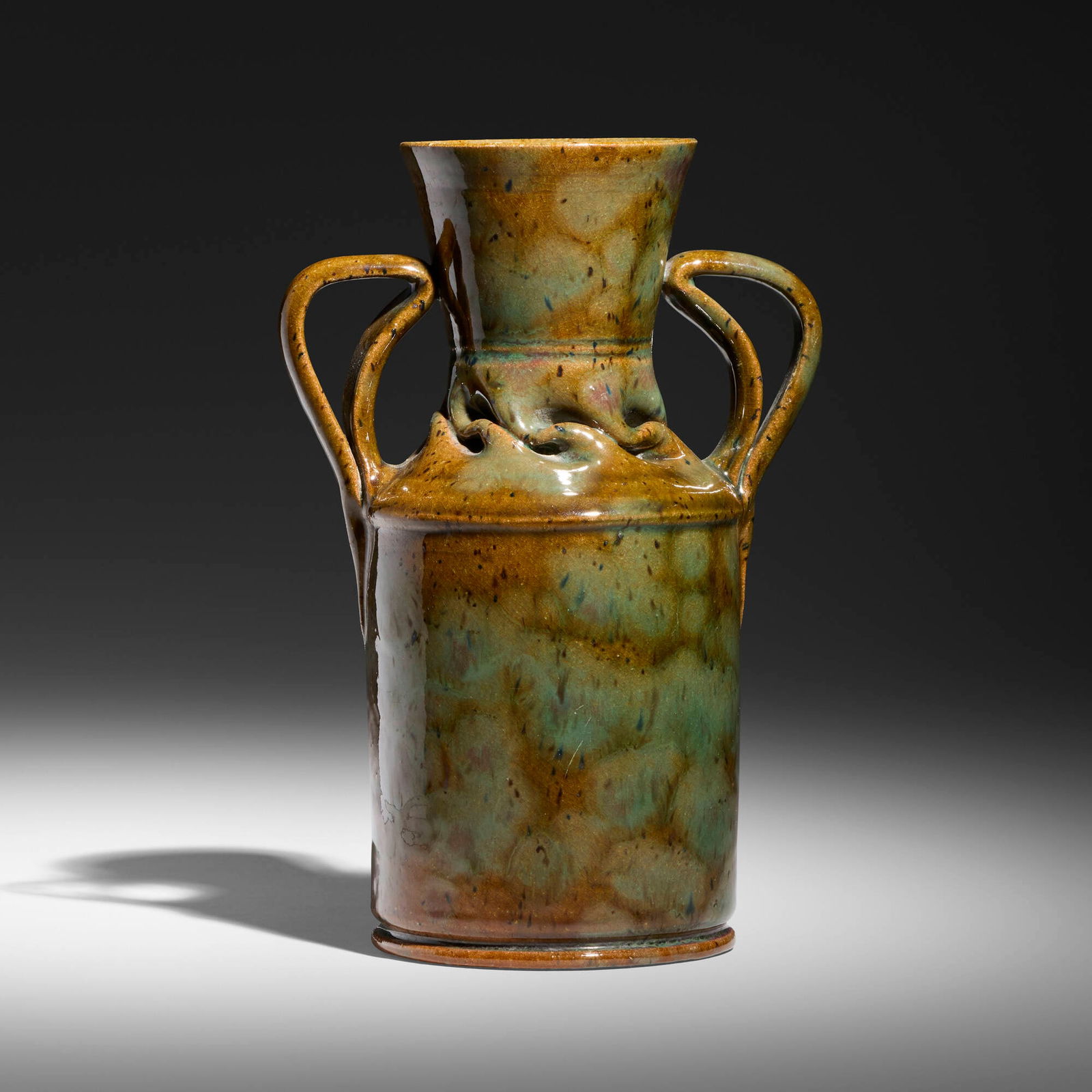 George E. Ohr, Vase: George E. Ohr Vase USA, 1895-96 glazed earthenware 7.25 h x 5 w x 3.25 d in (18 x 13 x 8 cm) Vase features a flared rim, in-body twist, and two ear-shaped handles with a sponged-on light blue and
