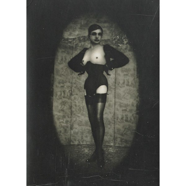 Pierre Molinier (French, 1900-1976): Chaman (Self-portrait: standing/corset/mask), ca. 1965; Gelatin silver print; Artist stamp; 7" x 5"