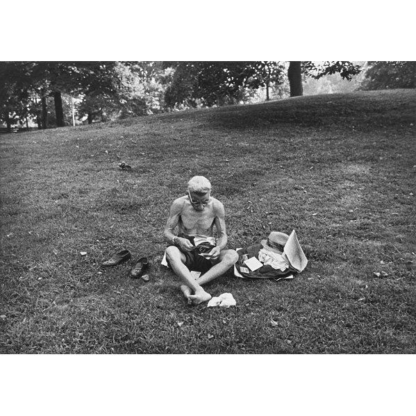 Bruce Davidson (American, b. 1933): Untitled (Man Sitting on Grass), 1963; Gelatin silver print; Artist stamp; 8 3/4" x 12 1/8" (image); Provenance: Private Collection