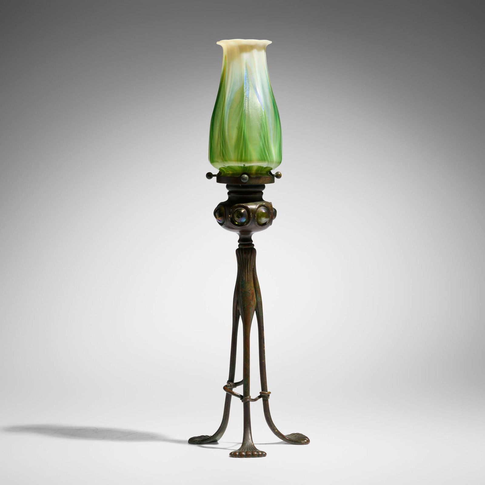 Tiffany Studios, Jeweled candlestick with pulled-feather shade: Tiffany Studios Jeweled candlestick with pulled-feather shade USA, c. 1910patinated bronze, hand-blown Favrile glass 16.5 h x 5.25 dia in (42 x 13 cm) Etched to shade 'L.C.T.'. Impressed to ba