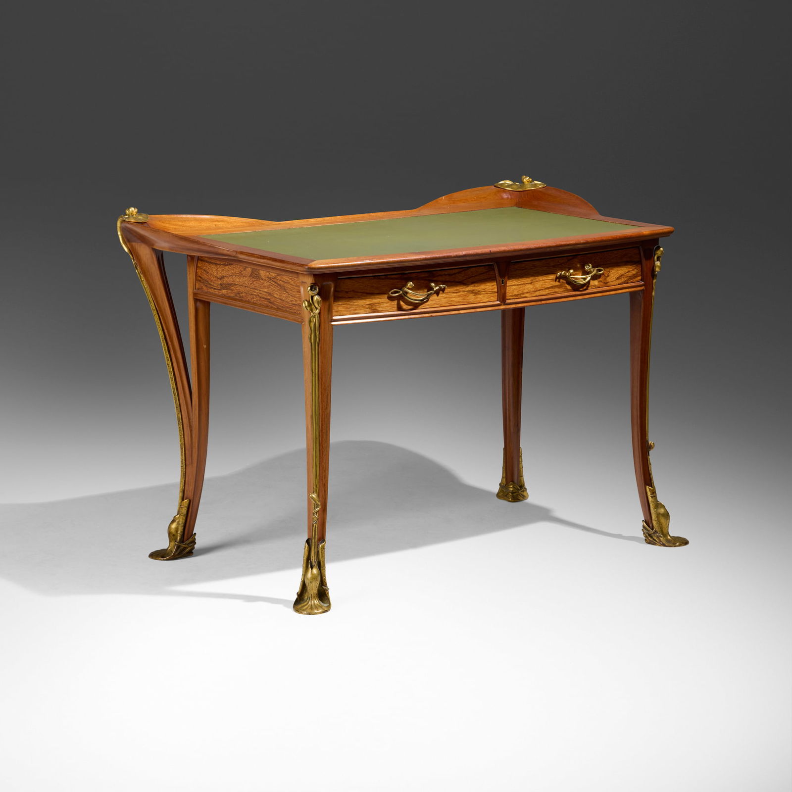 Louis Majorelle, Nenuphar lady's writing desk: Louis Majorelle Nenuphar lady's writing desk France, c. 1903mahogany, jatoba, gilt bronze, leather 32 h x 47.375 w x 28 d in (81 x 120 x 71 cm) Desk features two drawers. Paper label to unders