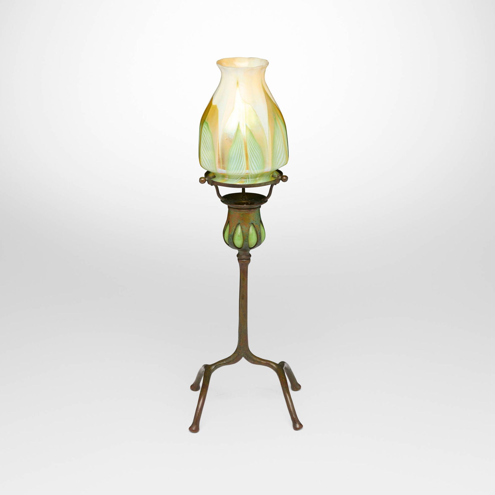 Tiffany Studios, Blown-out candlestick with ribbed pulled-feather shade: Tiffany Studios Blown-out candlestick with ribbed pulled-feather shade USA, c. 1910 patinated bronze, hand-blown Favrile glass 16.25 h x 5.25 w x 5.25 d in (41 x 13 x 13 cm) Etched to shade