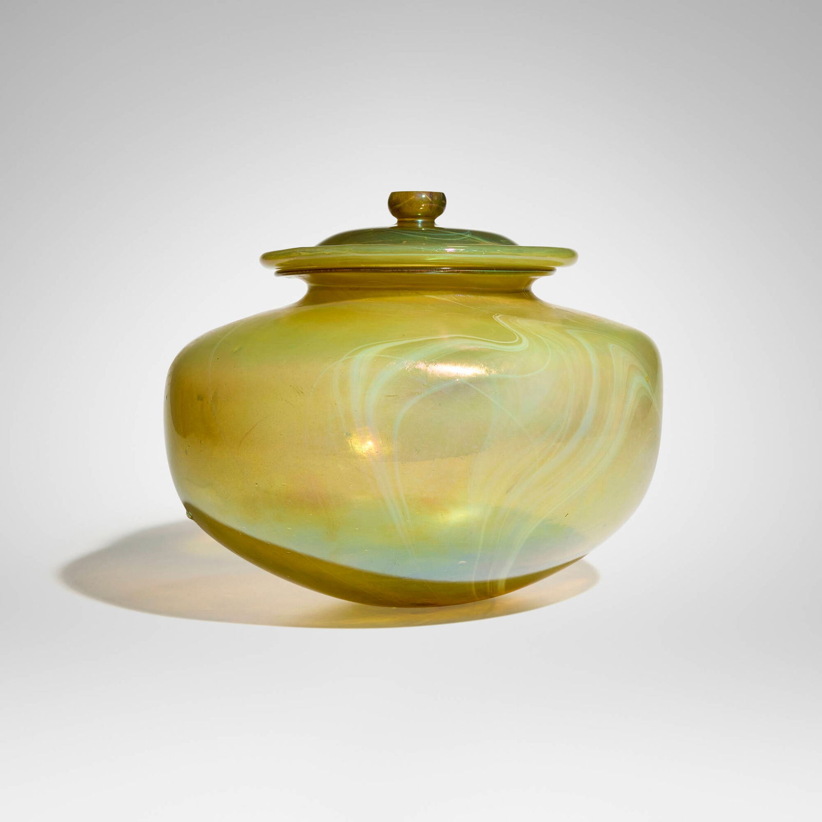 Tiffany Studios, Rare and Early covered jar: Tiffany Studios Rare and Early covered jar USA, c. 1895 hand-blown Favrile glass 11 h x 13.25 dia in (28 x 34 cm) Etched to underside of vessel 'x1310'. Provenance: Steve White Auction Gallery,