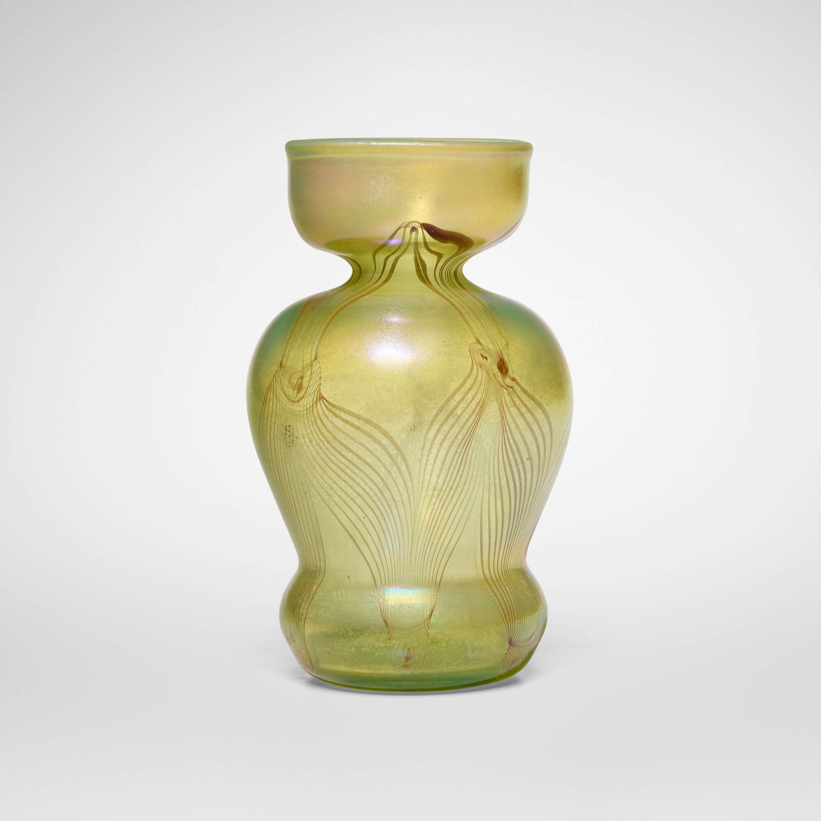 Tiffany Studios, Early experimental pulled-feather vase with cupped top: Tiffany Studios Early experimental pulled-feather vase with cupped top USA, c. 1895hand-blown Favrile glass 6.5 h x 3.875 dia in (17 x 10 cm) Etched to underside 'X880'. Provena