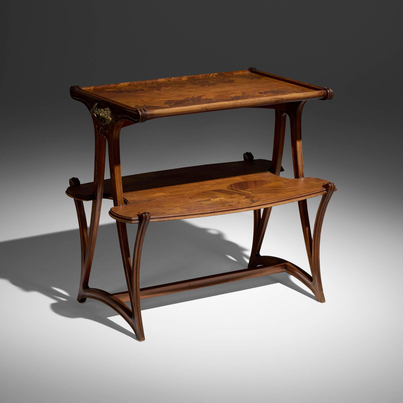 Louis Majorelle, Marquetry tea table with aquatic flowers: Louis Majorelle Marquetry tea table with aquatic flowers France, c. 1900 mahogany, mixed wood inlay, gilt bronze 32 h x 35.5 w x 22.5 d in (81 x 90 x 57 cm) Provenance: Private Estate, California 