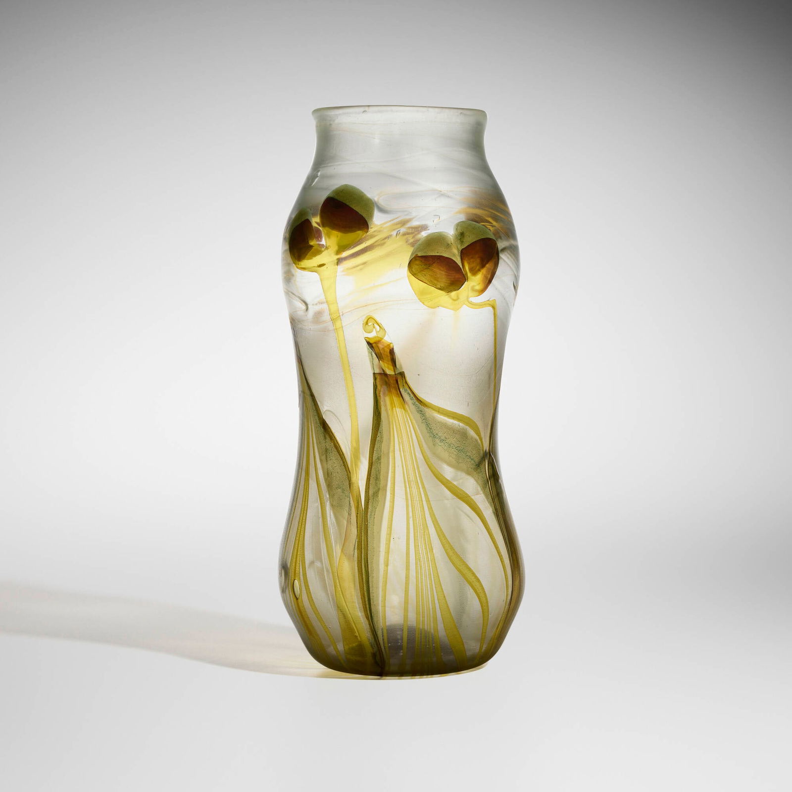 Tiffany Studios, Decorated vase: Tiffany Studios Decorated vase USA, c. 1900 hand-blown Favrile glass 12.875 h x 5.5 dia in (33 x 14 cm) Vase features pulled feather and leaf and vine patterns. Original paper label to underside