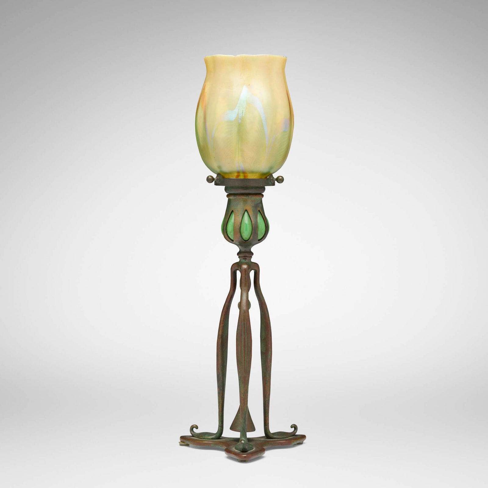 Tiffany Studios, Tripod candlestick with snuffer and ribbed pulled-feather shade: Tiffany Studios Tripod candlestick with snuffer and ribbed pulled-feather shade USA, c. 1910patinated bronze, hand-blown Favrile glass, hand-blown glass 15.5 h x 5.5 dia in (39 x 14 cm) Etched