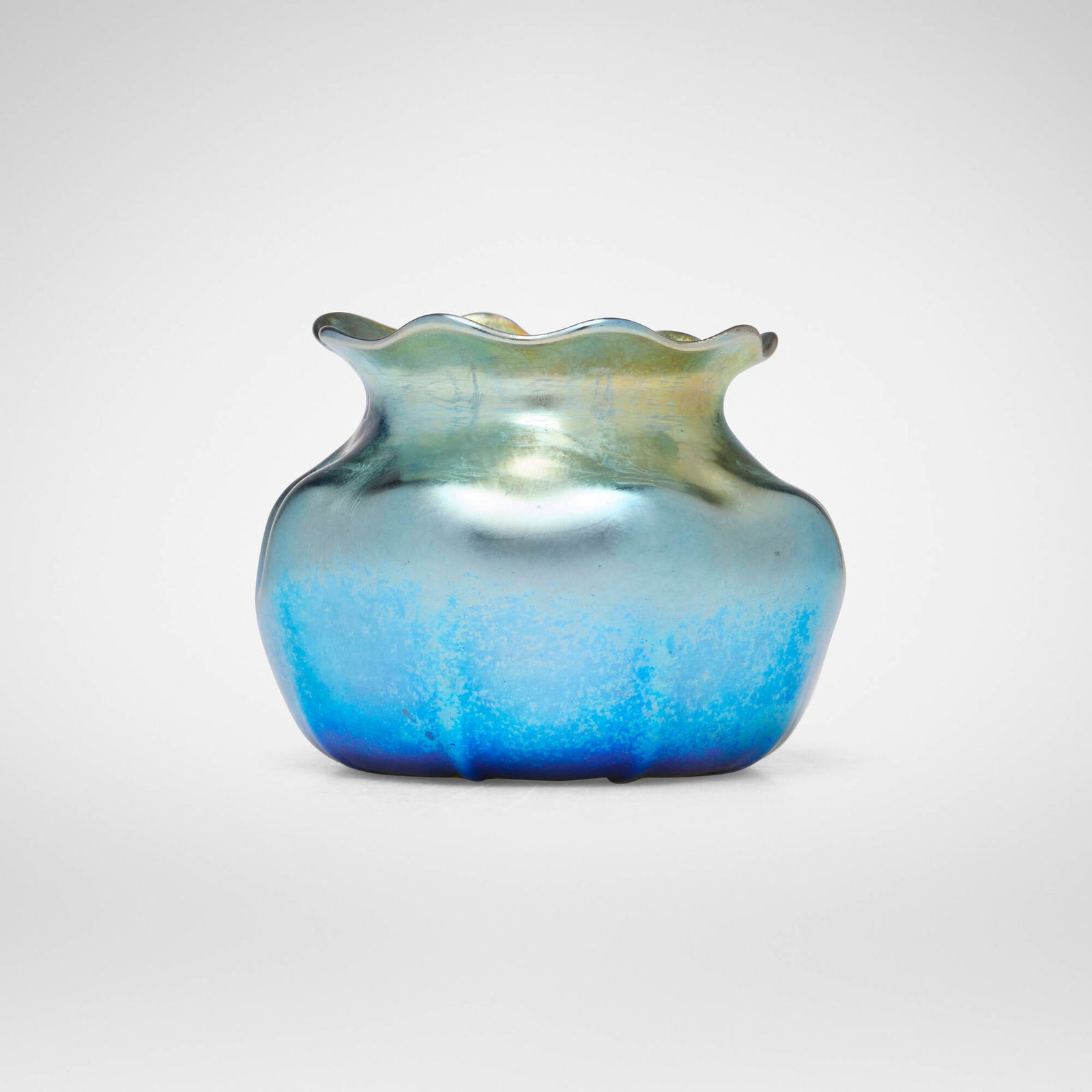 Tiffany Studios, Early ribbed cabinet vase: Tiffany Studios Early ribbed cabinet vase USA, c. 1898hand-blown Favrile glass 2 h x 3 dia in (5 x 8 cm) Etched to underside 'L.C.T. o8297'. This work will ship from Lamber