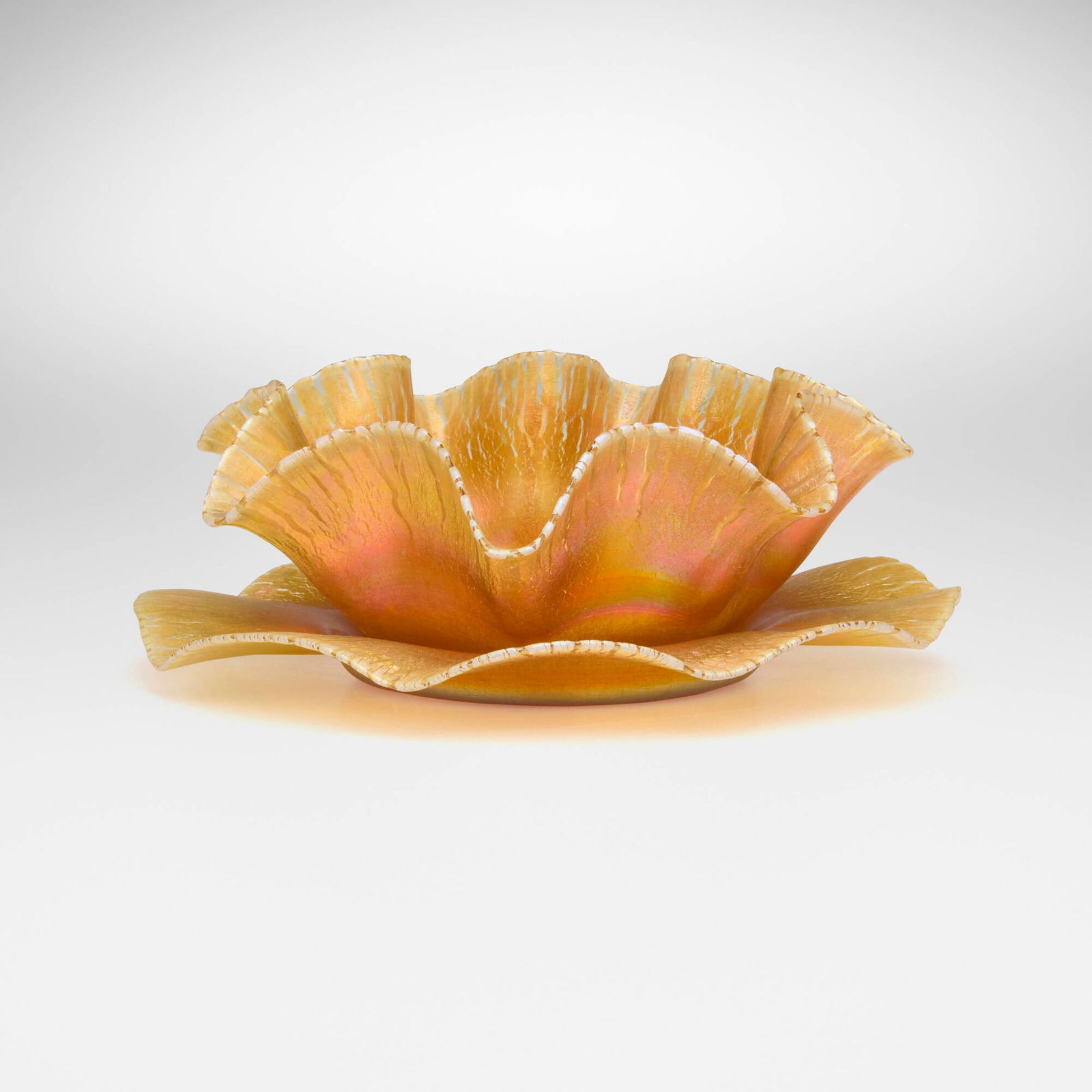 Tiffany Studios, Earl finger bowl and underplate: Tiffany Studios Earl finger bowl and underplate USA, c. 1898 hand-blown Favrile glass 2.25 h x 6.25 dia in (6 x 16 cm) 0.625 h x 7 dia in (2 x 18 cm) Etched to each element 'L.C.T. 8919'. 