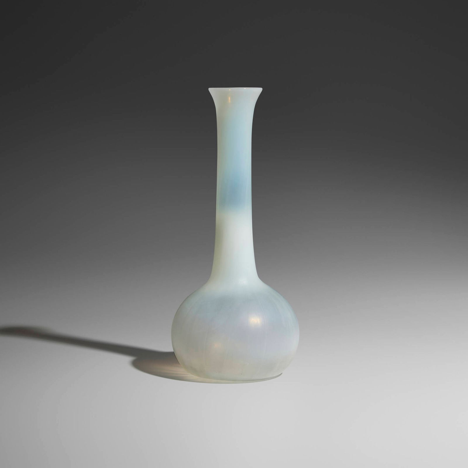 Tiffany Studios, Tall bud vase: Tiffany Studios Tall bud vase USA, c. 1900hand-blown Favrile glass 11 h x 4.75 dia in (28 x 12 cm) Paper manufacturer's label to underside 'Tiffany Favrile Glass TGDCO Registered Trademark'.