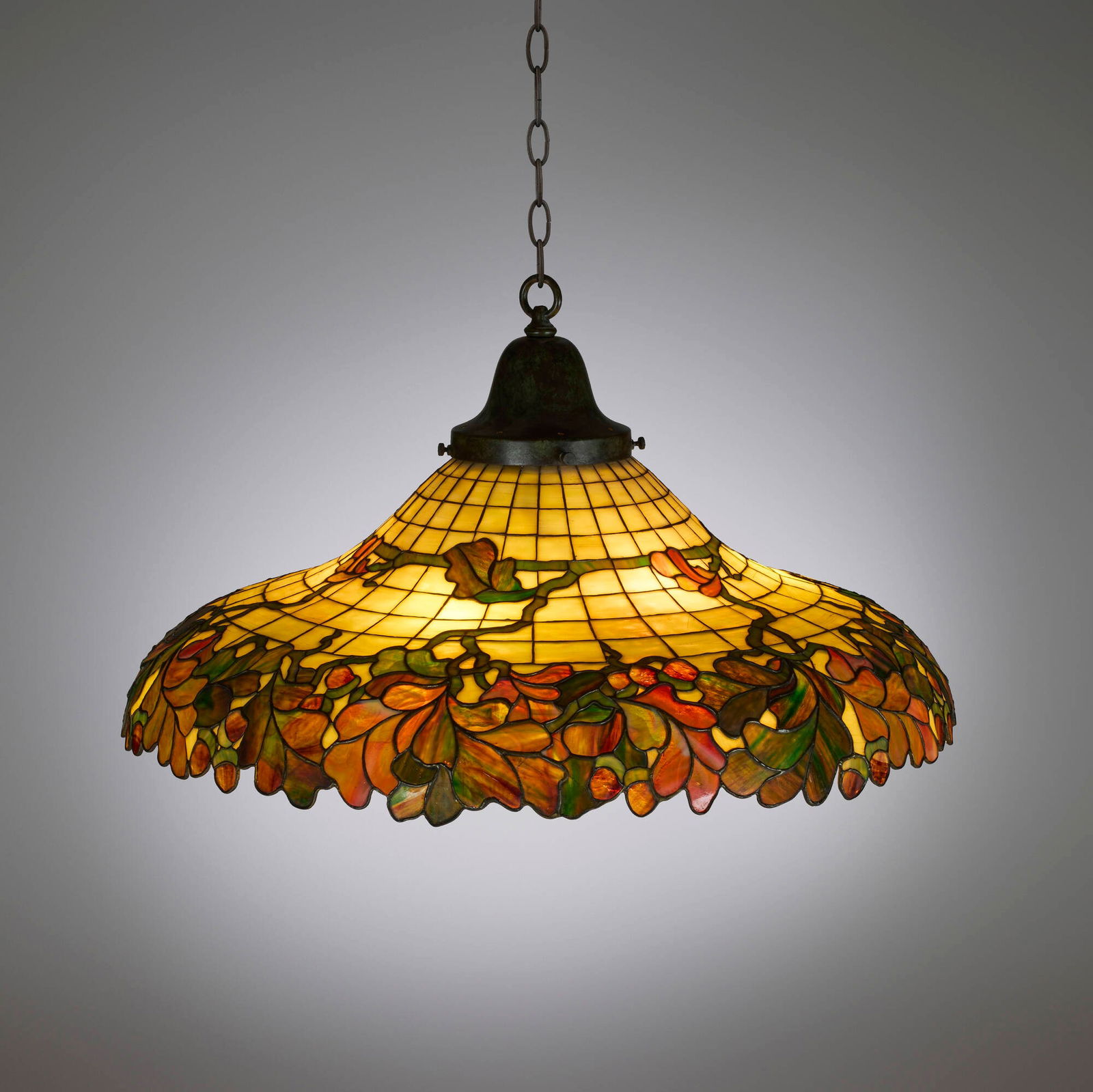 John Morgan & Sons, Oak Leaf & Acorn hanging lamp: John Morgan & Sons Oak Leaf & Acorn hanging lamp USA, c. 1905 leaded glass, patinated metal 15.5 h x 28.5 dia in (39 x 72 cm) Provenance: Collection of Gary Diamond, Los Angeles Literature: