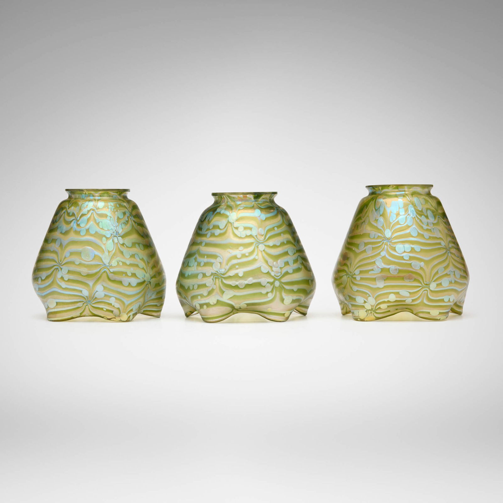 Loetz, Phanomen shades, set of three: Loetz Phanomen shades, set of three Austria, c. 1900 hand-blown glass 4.5 h x 4.5 dia in (11 x 11 cm) This work will ship from Lambertville, New Jersey.