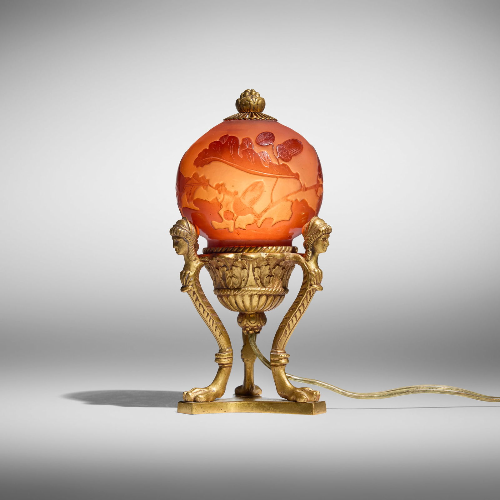 Galle, Boudoir lamp with oak leaves and acorns: Galle Boudoir lamp with oak leaves and acorns France, c. 1920 glass, acid-etched cameo glass, gilt bronze 7 h x 3.5 w x 3 d in (18 x 9 x 8 cm) Signed in cameo to shade 'Galle'. Provenance: