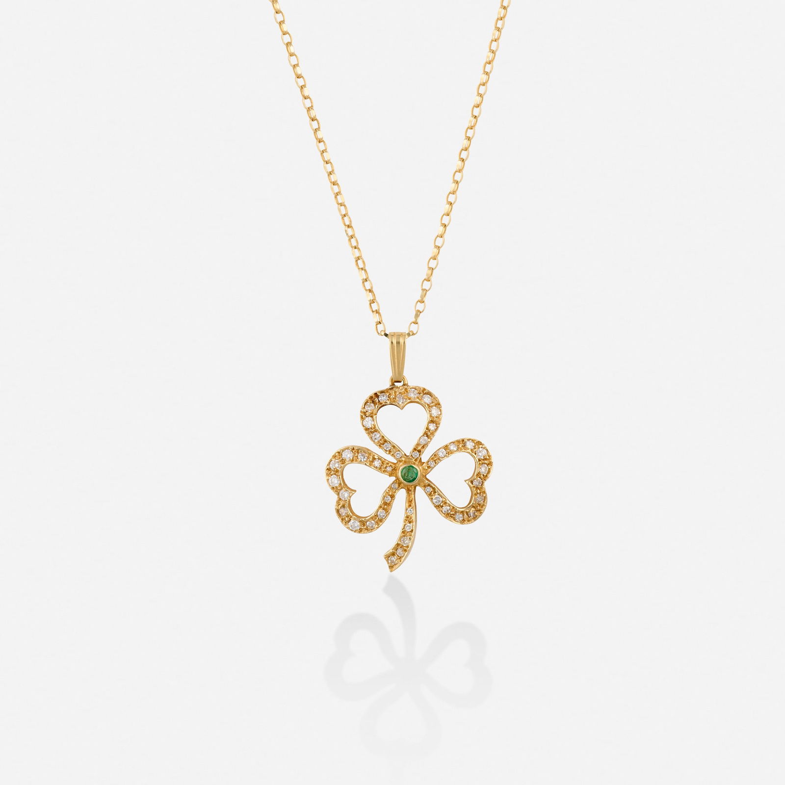 Diamond, emerald, and gold necklace: Diamond, emerald, and gold necklace The clover pendant set with a circular-cut emerald, round brilliant and single-cut diamonds 14k yellow gold Necklace 18 in, pendant 1.375 x 1 in; Gross weight 3.6