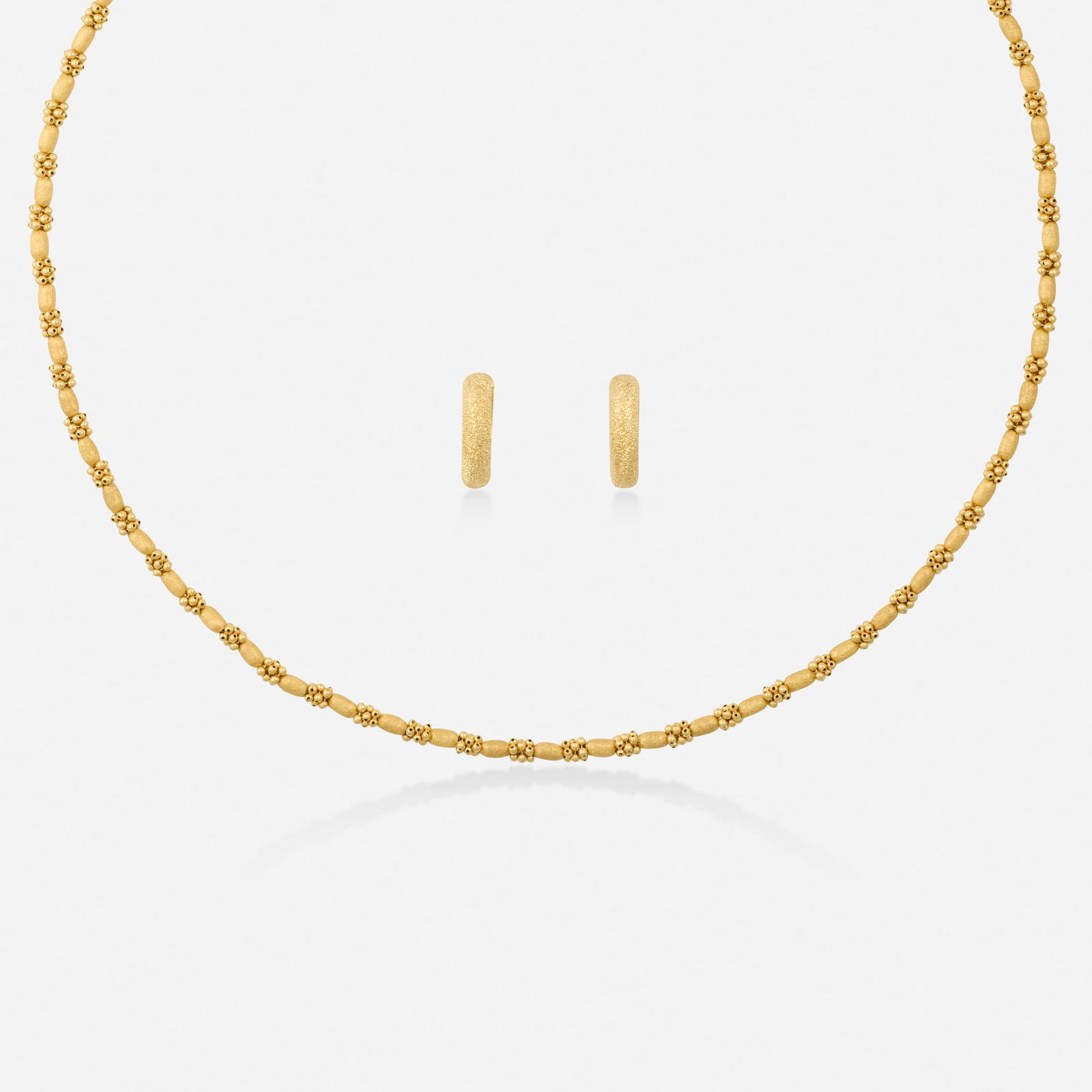 Italian, Gold necklace and earrings: Italian Gold necklace and earrings Each of textured or beaded gold 18k yellow gold Necklace 16.50 in, earrings approx. 0.50 x 0.125 in; Gross weight 11.4 dwts This work will ship from