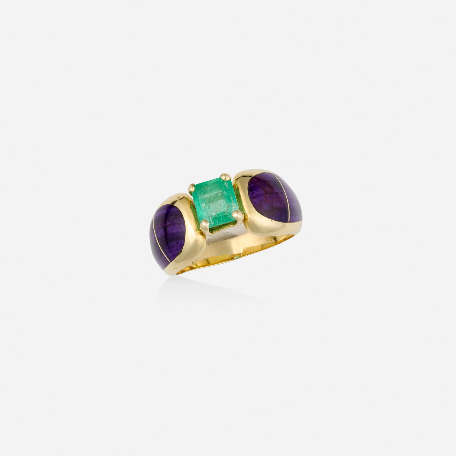 Emerald, sugilite, and gold ring: Emerald, sugilite, and gold ring Set with an emerald-cut emerald, the shoulders inlaid with sugilite 14k yellow gold Ring size 7.25; Gross weight 4.2 dwts This work will ship from Lambertville,