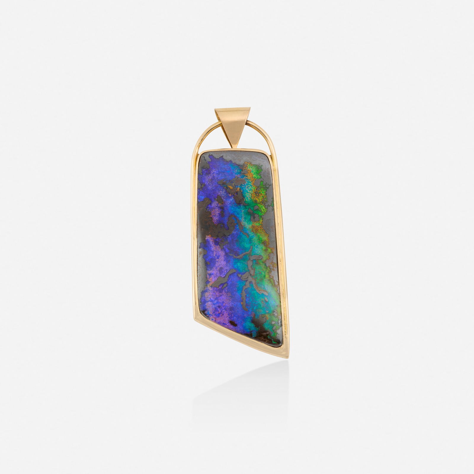 Boulder opal and gold pendant: Boulder opal and gold pendant Set with a polished boulder opal 18k yellow gold 2.25 x 0.75 in; Gross weight 12.6 dwts This work will ship from Lambertville, New Jersey.