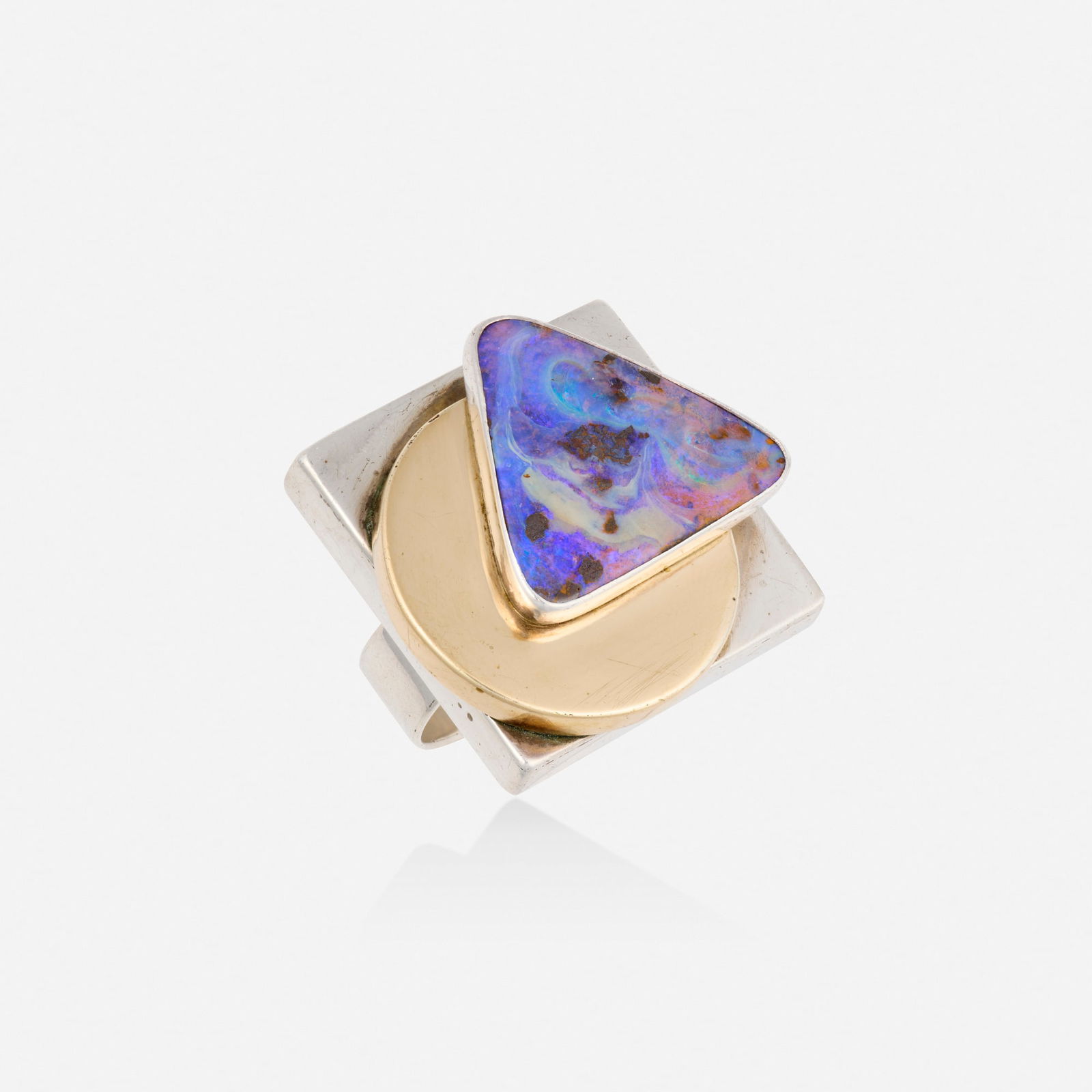 Boulder opal, silver, and gold ring: Boulder opal, silver, and gold ring Of geometric design, set with polished boulder opal Sterling silver and 14k yellow gold Ring size 8.25; Gross weight 17.0 dwts This work will ship from Lambertville