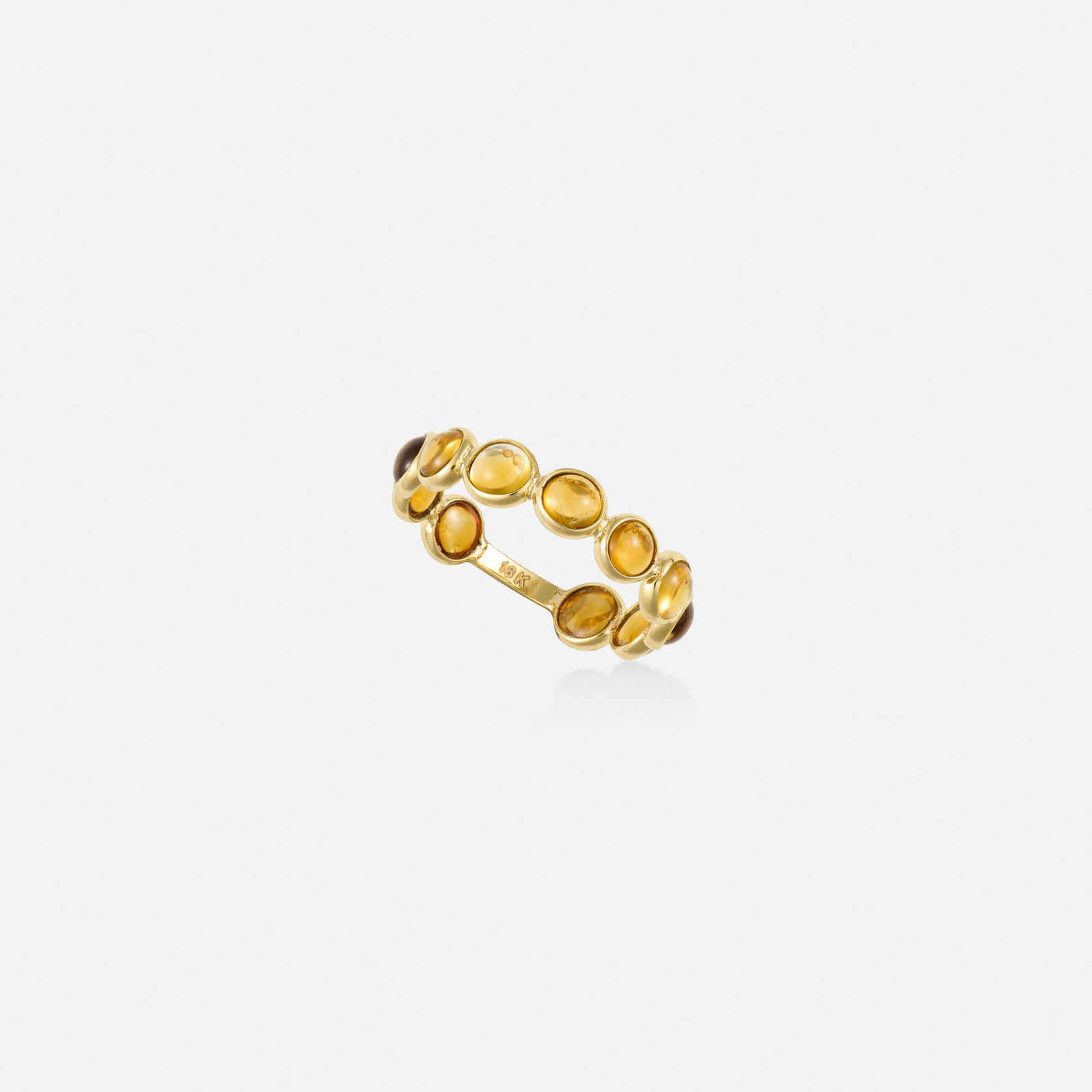 Citrine and gold ring: Citrine and gold ring Set with cabochon citrines 18k yellow gold Ring size 6.75; Gross weight 1.0 dwts This work will ship from Lambertville, New Jersey.
