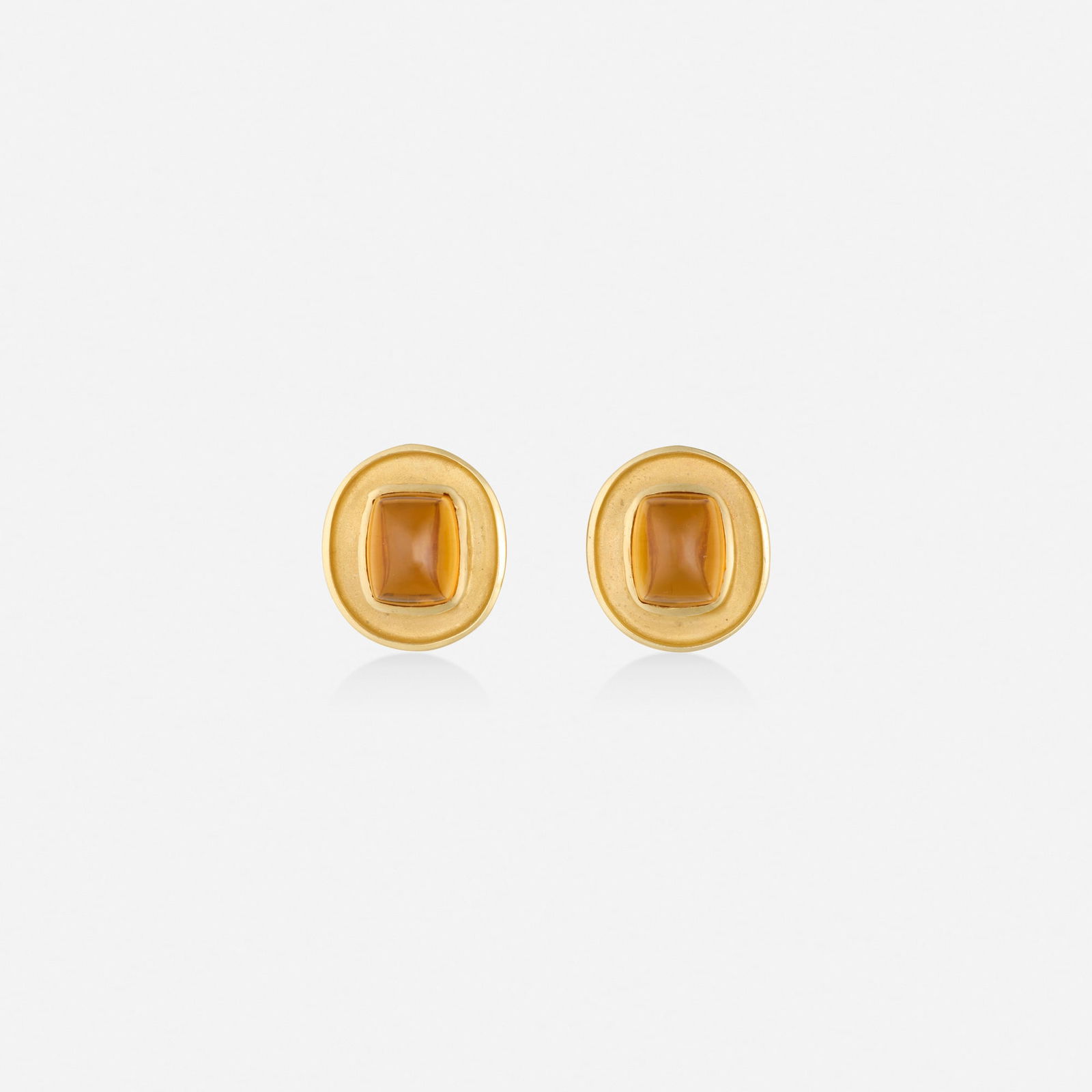 Citrine and gold earrings: Citrine and gold earrings Each set with a cabochon citrine 14k yellow gold 0.75 x 0.625 in; Gross weight 8.7 dwts This work will ship from Lambertville, New Jersey.