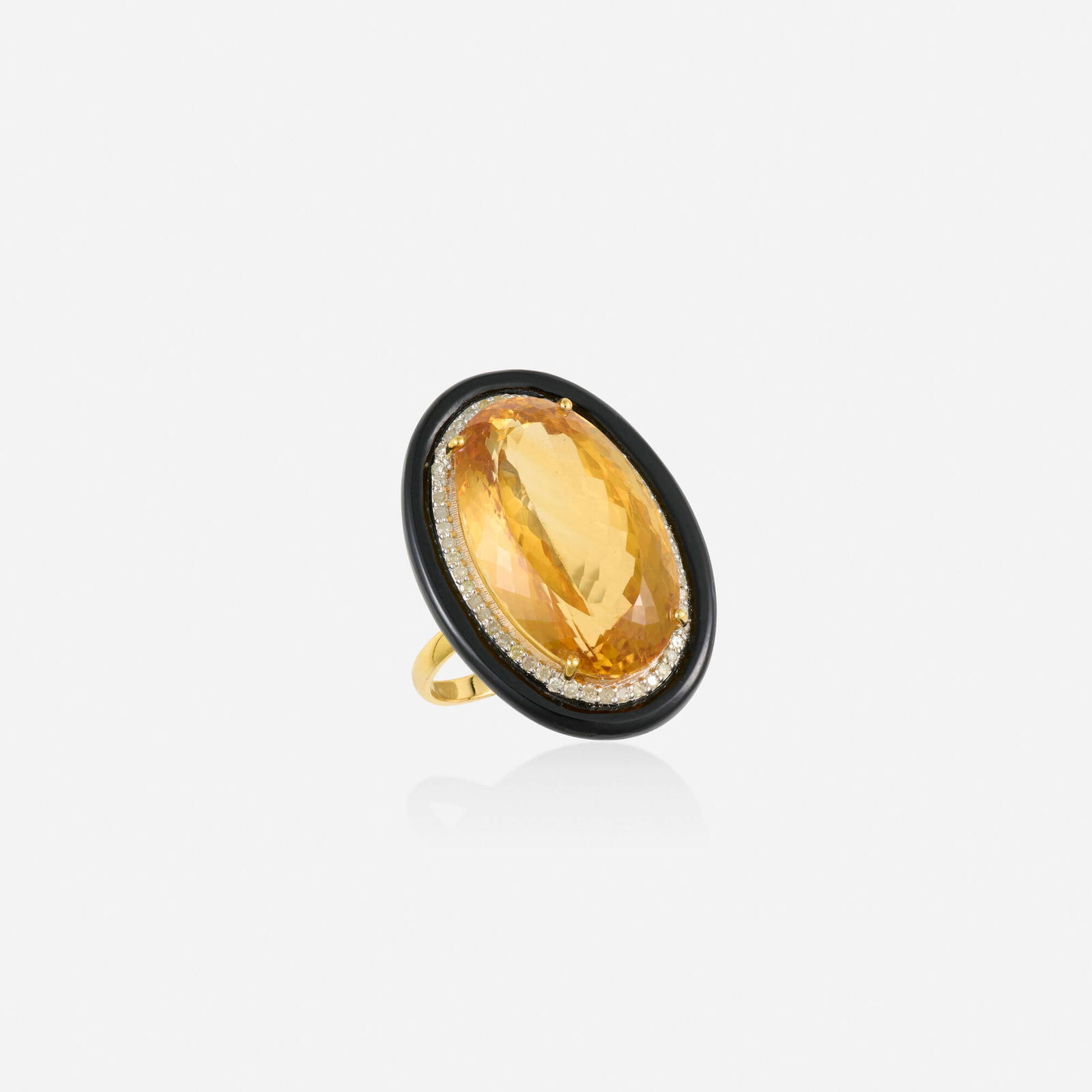 Citrine, black onyx, and diamond ring: Citrine, black onyx, and diamond ring Set with an oval-cut citrine, framed by single-cut diamond and polished black onyx Silver and yellow gold Ring size 6.75; Gross weight 6.1 dwts This work