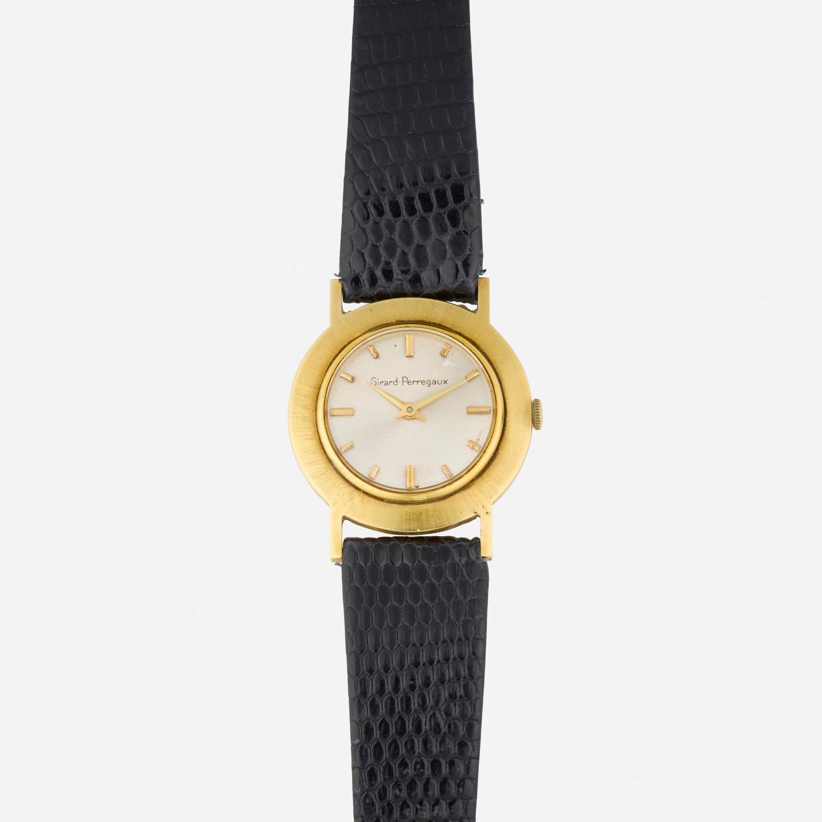 Girard-Perregaux, Gold wristwatch: Girard-Perregaux Gold wristwatch With baton hours Dial: Silvered Movement: Manual wind Case material: 18k yellow gold Case size: 31 mm Bracelet/Strap: Black leather strap, 8.25 in Clasp/Buckle: Pin