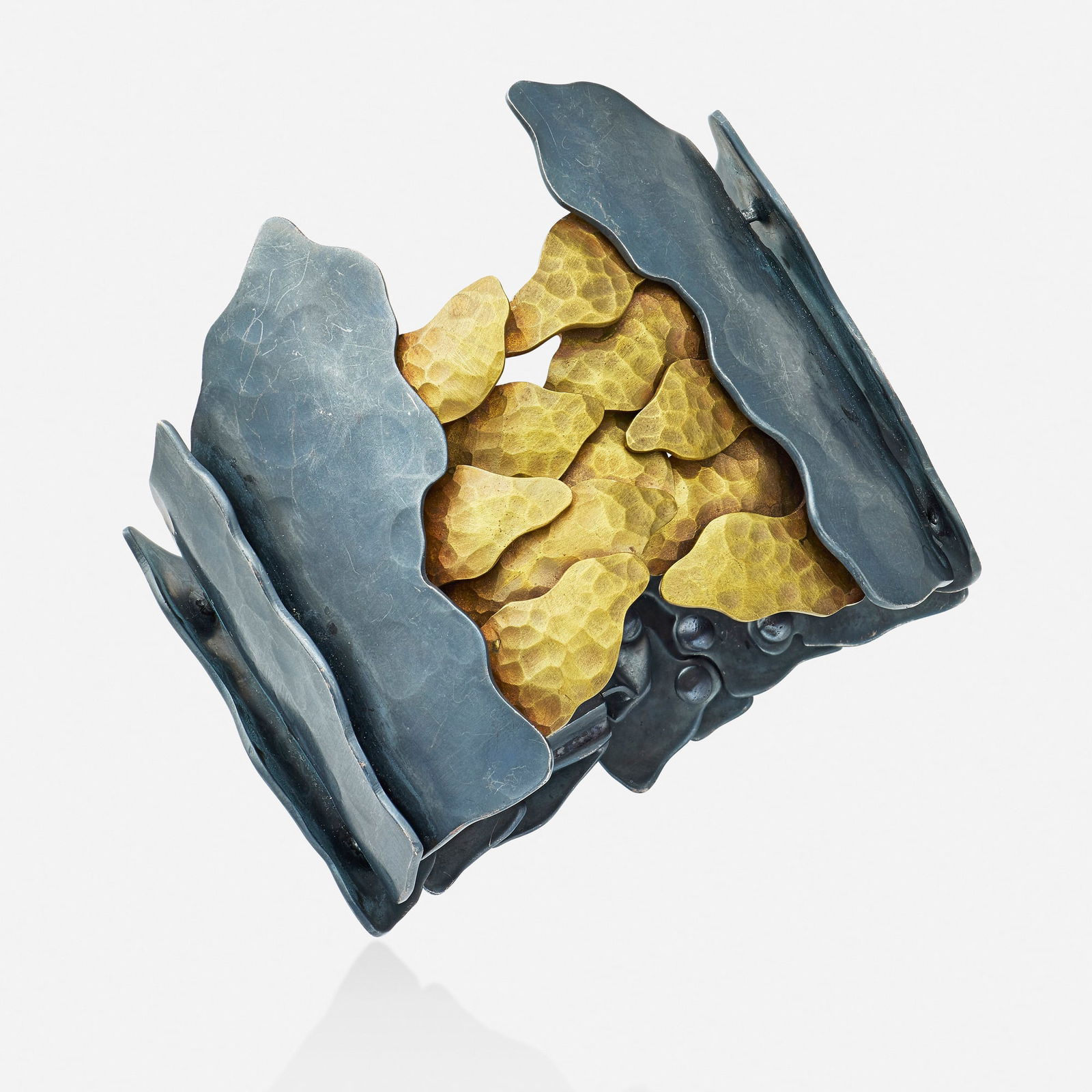 RomoHerrera, Oxidized silver and tumbaga bracelet: RomoHerrera Oxidized silver and tumbaga bracelet Of hammered links; 2020s Oxidized silver and tumbaga Signed with maker's mark for RomoHerrera Inner circ. 6.50 in, width 2.50 in; Gross weight 79.3