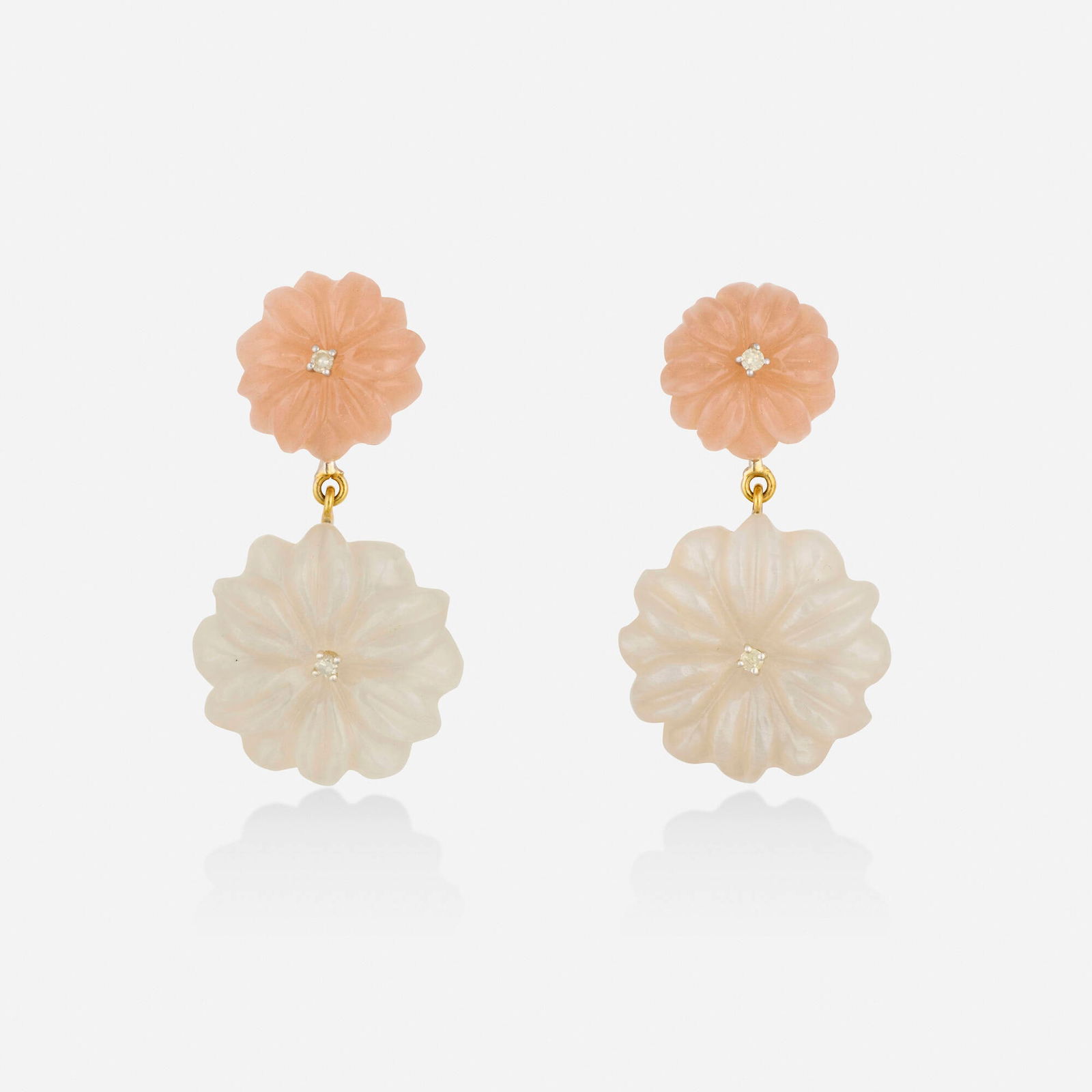 Moonstone and diamond earrings: Moonstone and diamond earrings Each set with two carved moonstone flowers with single-cut diamond centers Silver and yellow gold 1.375 x 0.75 in; Gross weight 6.6 dwts This work will ship from