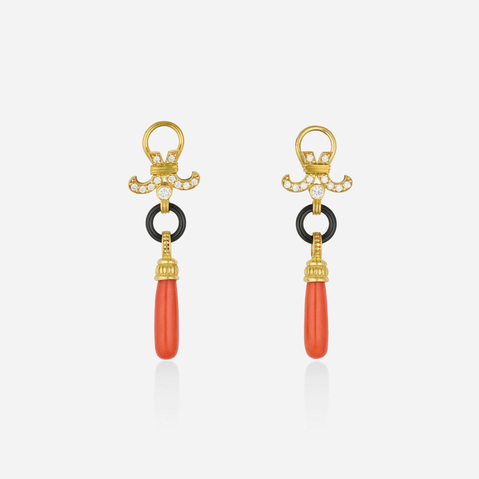Coral, black onyx, and gold earrings: Coral, black onyx, and gold earrings Each set with round brilliant-cut diamonds, a black onyx ring, and a coral drop 18k yellow gold 1.75 x 0.625 in; Gross weight 6.9 dwts This work will ship
