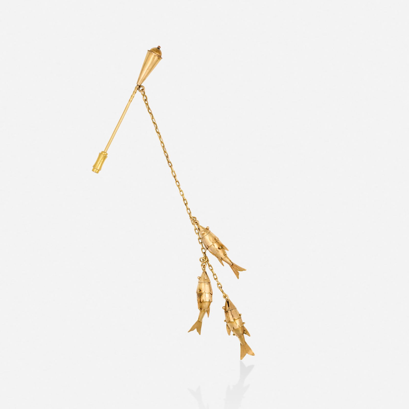 Gold brooch: Gold brooch The rod suspending three articulated fish Yellow gold 2.50 x 5.25 in; Gross weight 5.2 dwts This work will ship from Lambertville, New Jersey.