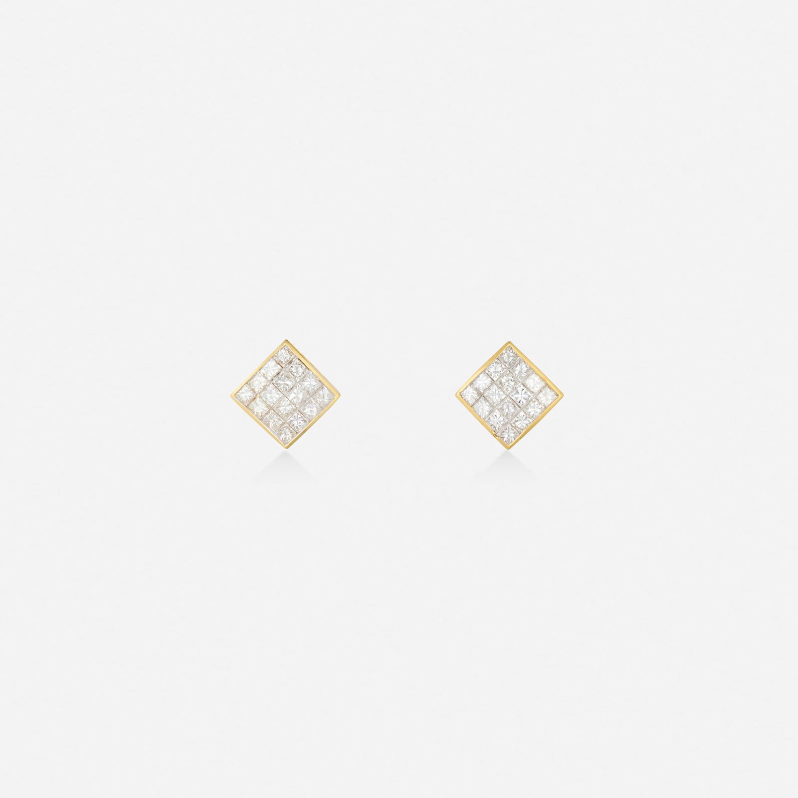 Diamond and gold earrings: Diamond and gold earrings Each invisibly-set with princess-cut diamonds 18k yellow gold-plated white gold 0.50 x 0.50 in; Gross weight 3.7 dwts This work will ship from Lambertville, New Jersey.