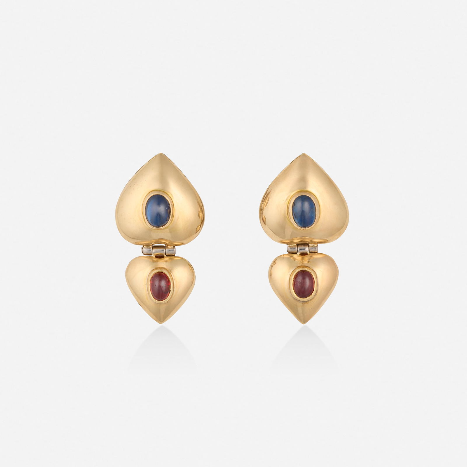 Sapphire, garnet, and gold earrings: Sapphire, garnet, and gold earrings Each designed with two heart-shaped stations set with cabochon sapphire and garnet Yellow gold and base metal 1.50 x 0.75 in; Gross weight 11.7 dwts This work